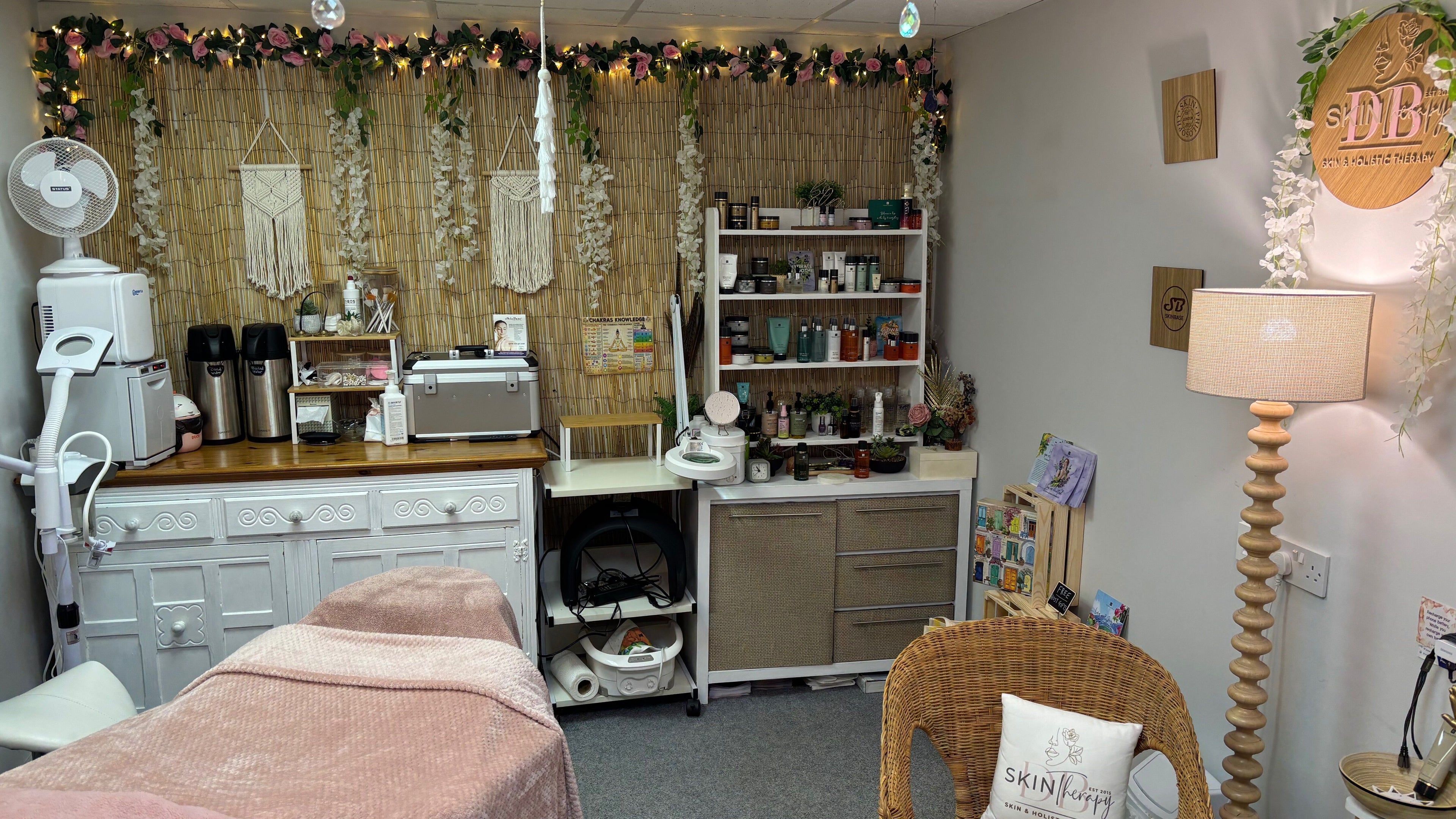 Cozy therapy room at DB Skin/Therapy, Cleator Moor, England, GB with skincare products and soft lighting.