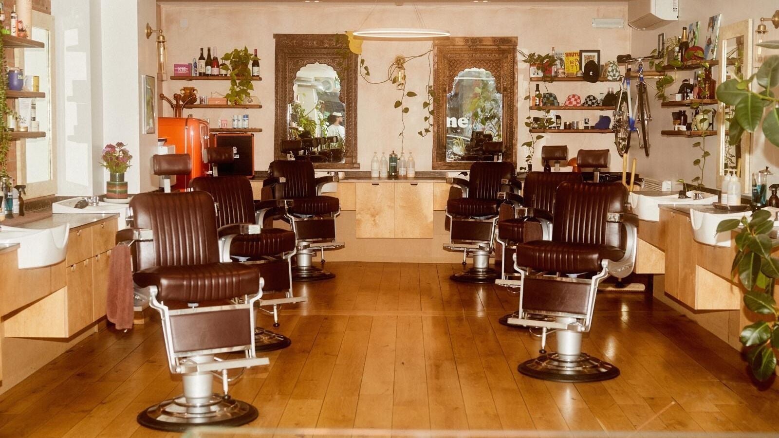 Stylish barber chairs at a chic salon in time., London, England, GB, highlighting elegant decor.