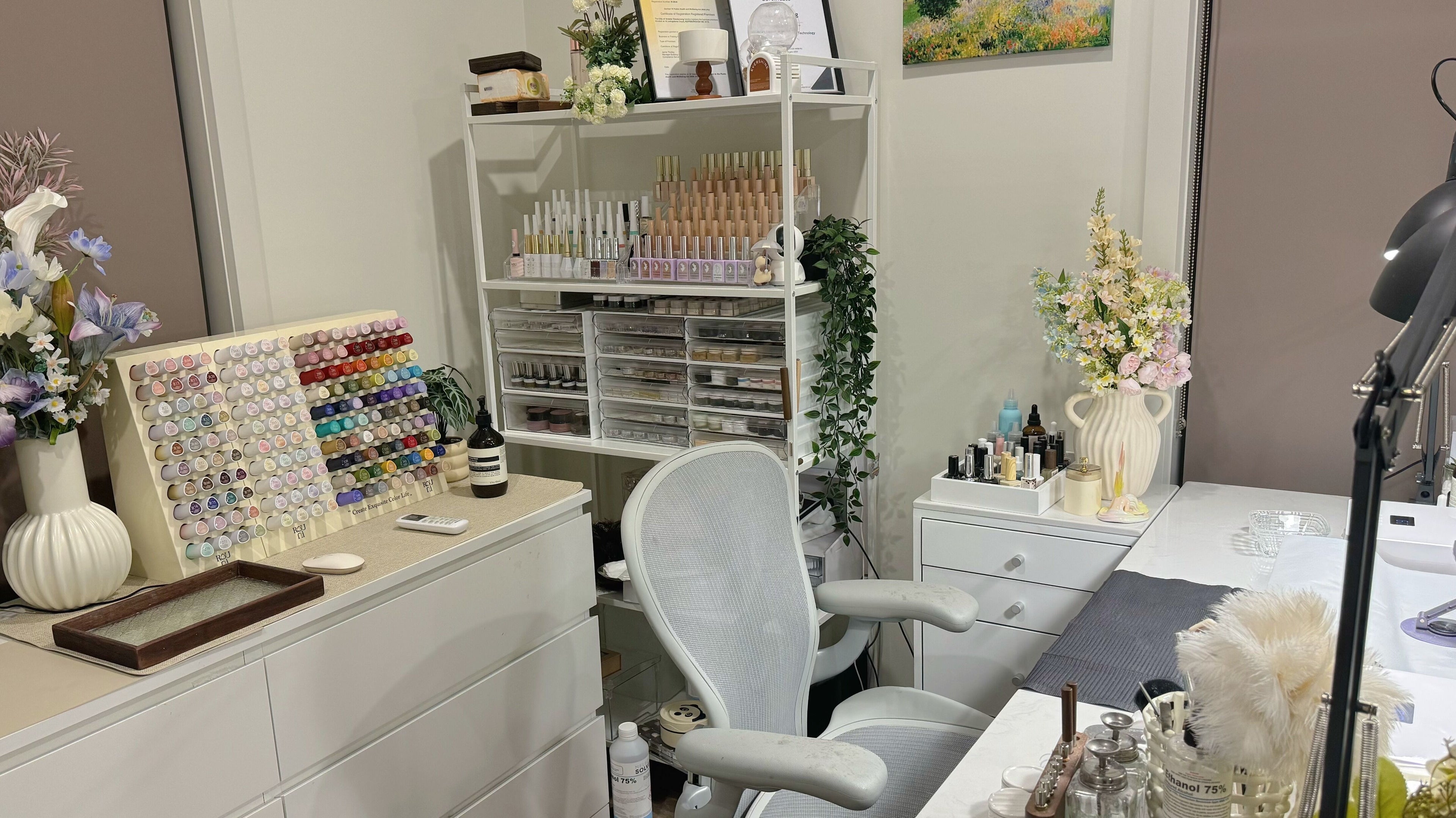 Vibrant nail polish display at Pixie Nail Art, Melbourne, Victoria, AU, showcasing a chic and inviting workspace.