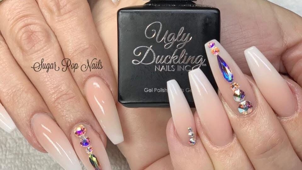 Elegant crystal embellished nails at Sugar Pop Nails, Kelowna, British Columbia, CA featuring delicate manicure.