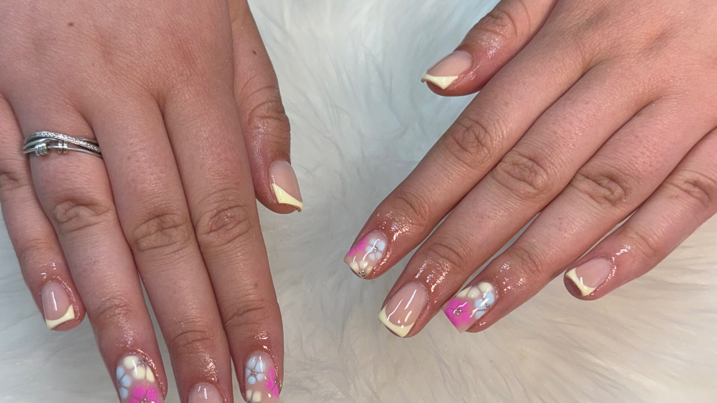 Beautiful floral nail art at Ebony Nails, Hamilton, Scotland, GB showcasing intricate designs and style.