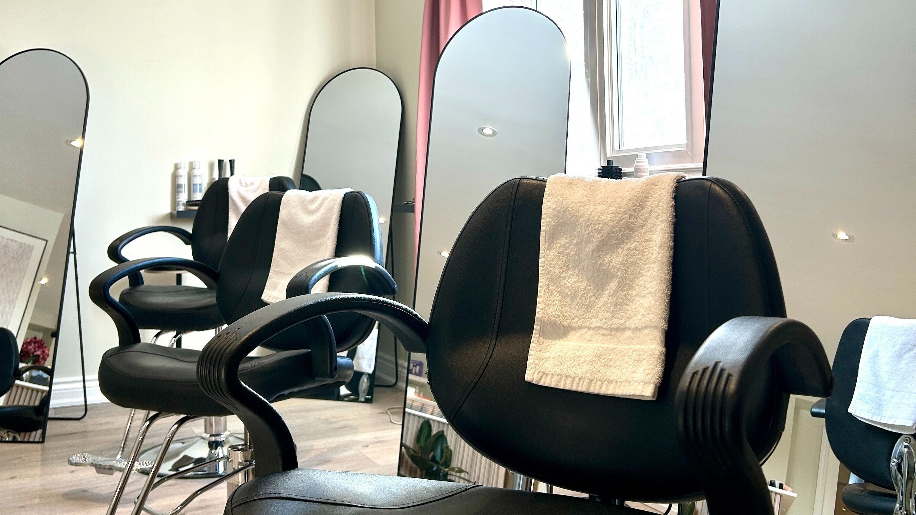 Comfortable salon chairs at Bella Vida Head Spa, Bowmanville, Ontario, CA, reflecting sophisticated style.