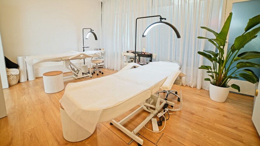 Relaxing treatment room at The Lash Squad, Melbourne, Victoria, AU, featuring two plush beds and modern decor.
