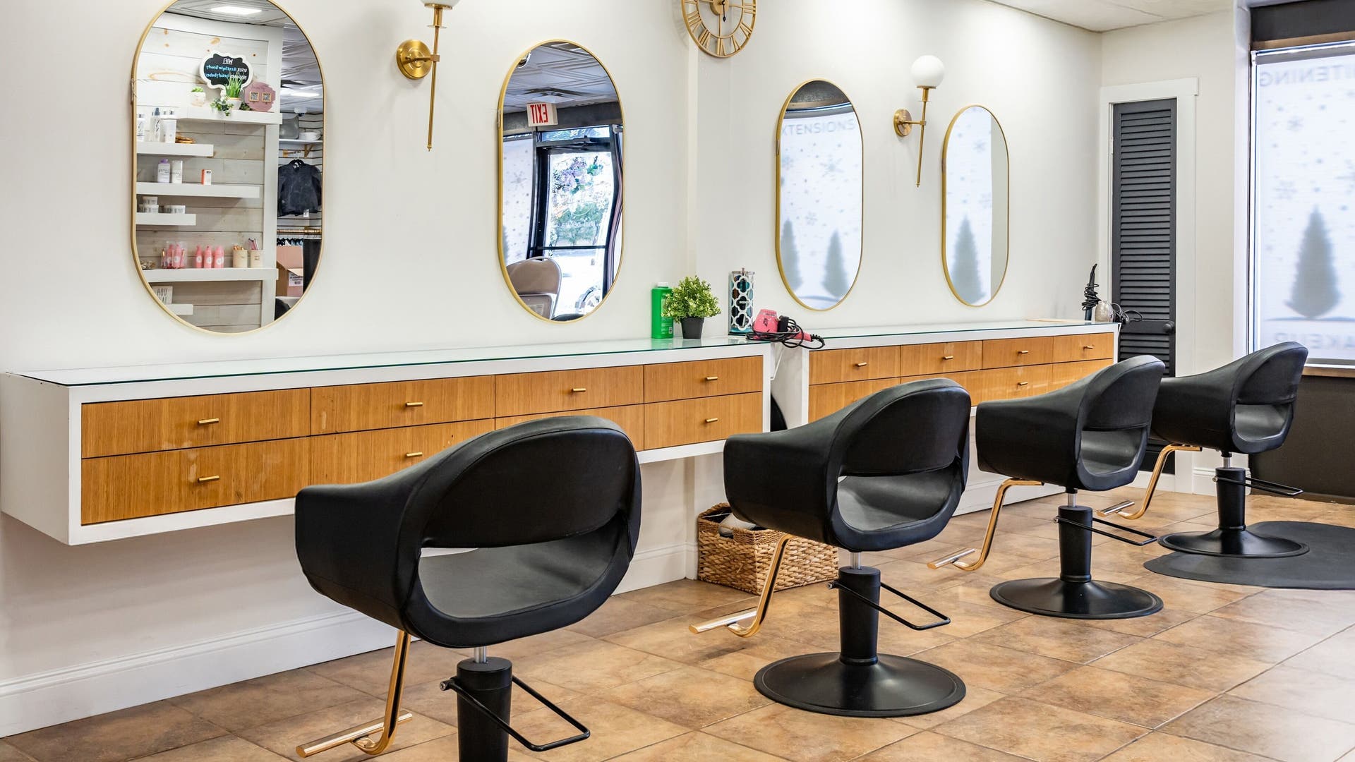 Modern salon chairs at Hair by Nicole Miller, Lindenhurst, New York, US, showcasing elegant design and comfort.