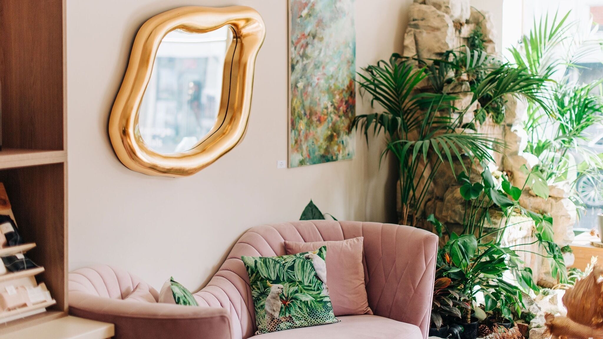 Luxurious pink seating and lush plants at Bayou Spa, London, England, GB, exude tranquility and elegance.