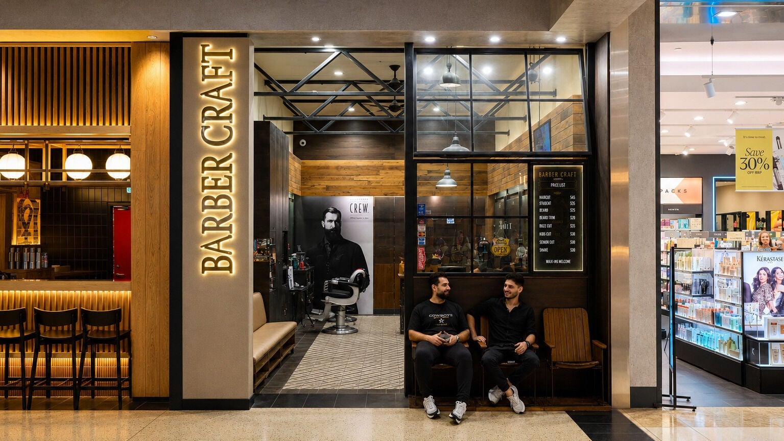 Barbercraft Doncaster entrance with seating in Melbourne, Victoria, AU, showcasing its modern design.