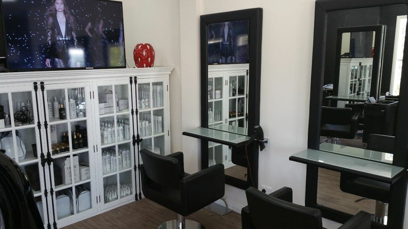 Modern styling station at Astonishing Hair, Melbourne, Victoria, AU showcasing elegance and professional products.