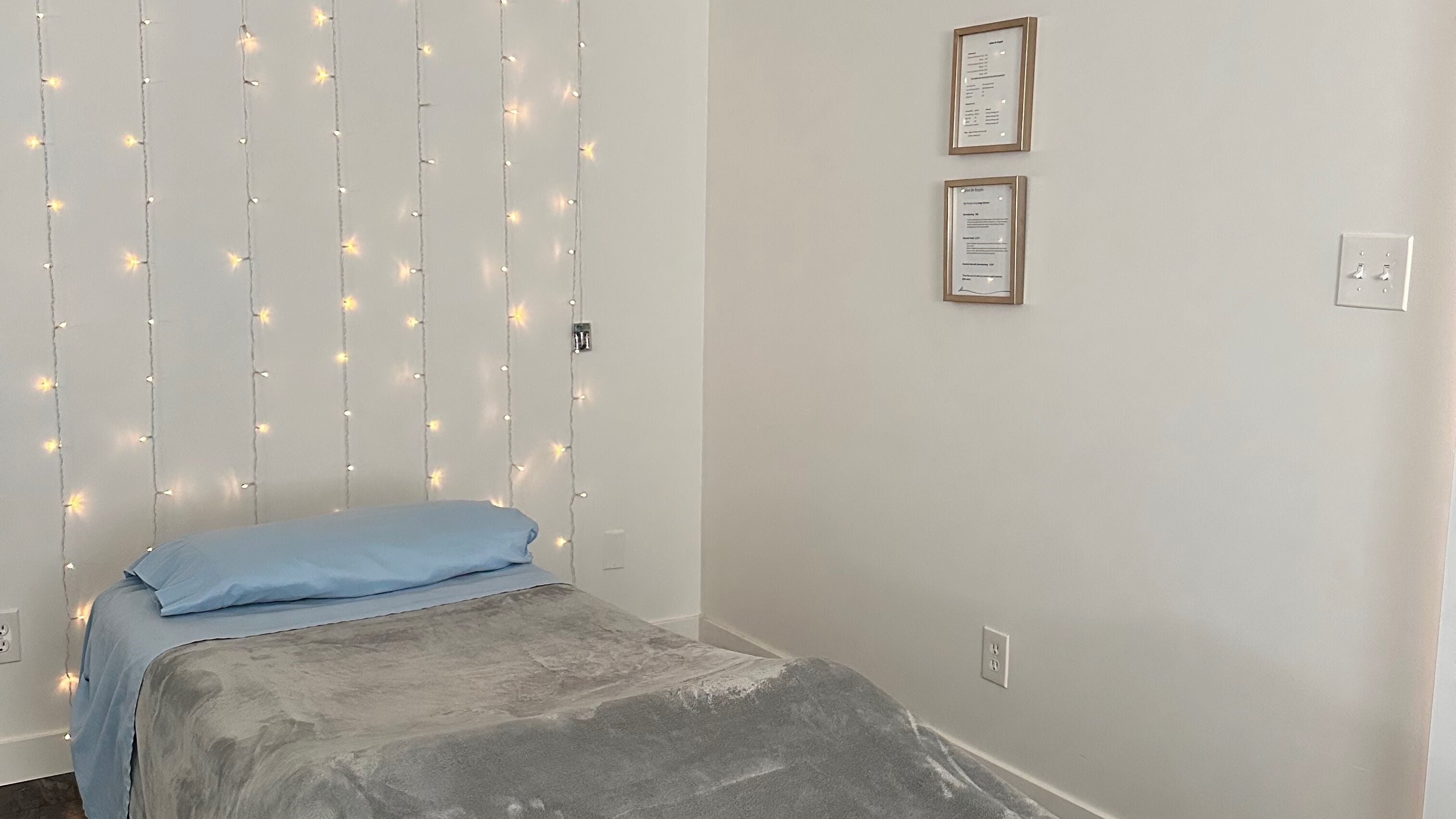 Relaxing massage room at Made for More Beauty and Massage, Edmonton, Alberta, CA, with calming lights.