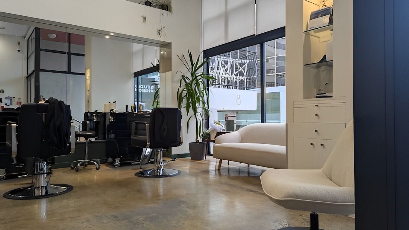 Modern interior of French Cut salon in Wellington, NZ, featuring elegant chairs and bright decor.