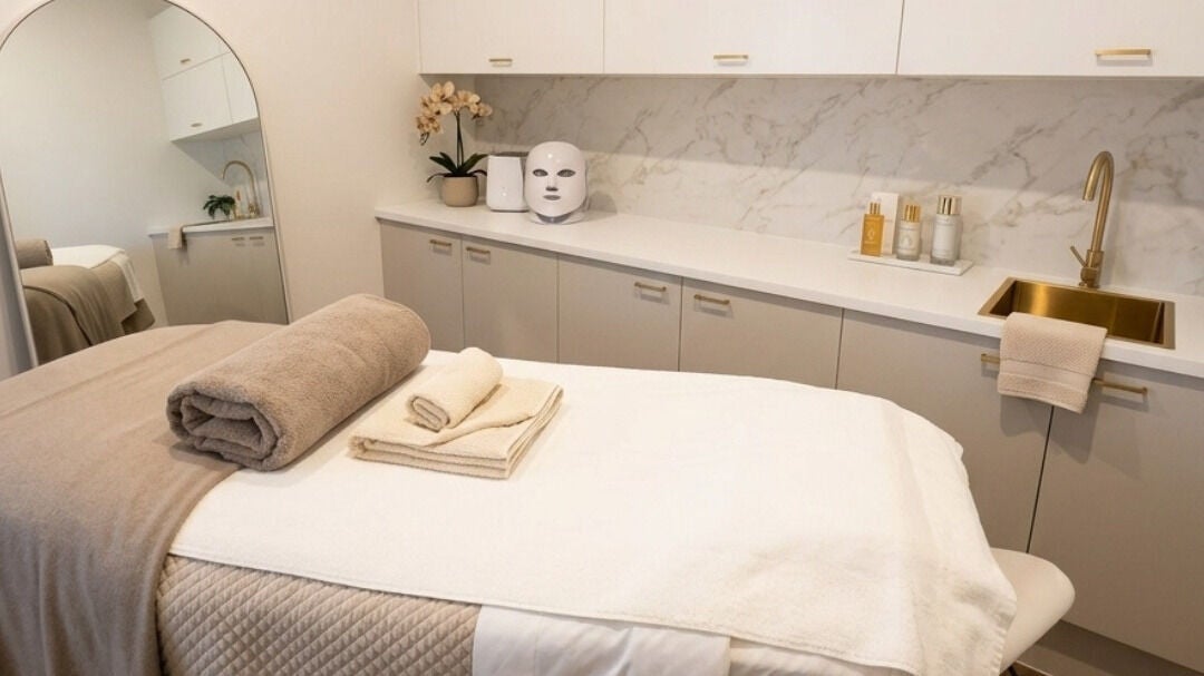 Massage room at e-skin in Southport, Queensland, AU with cozy linens and calming decor.