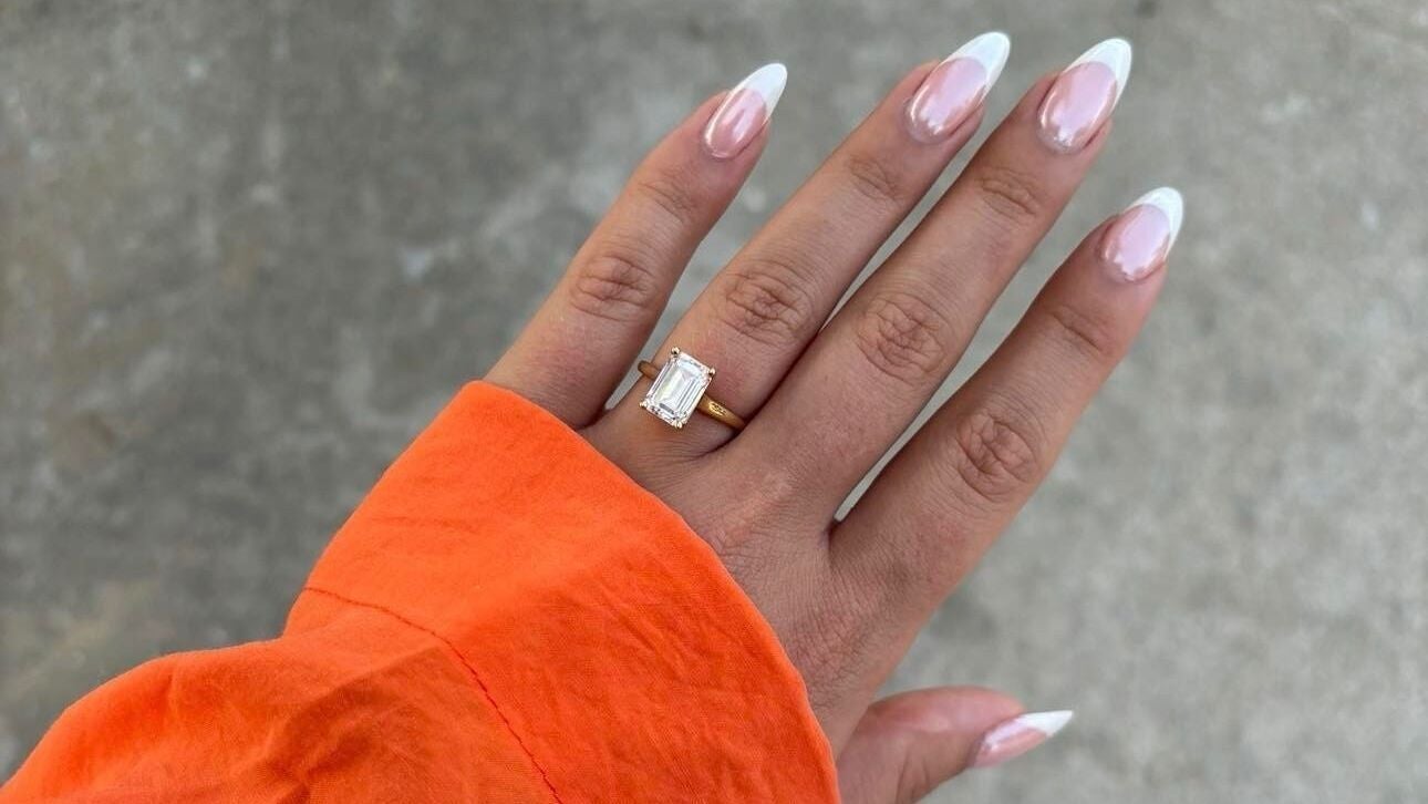 Close-up of elegant French manicure with ring at Nails by Chloe, Glasgow, Scotland, GB.