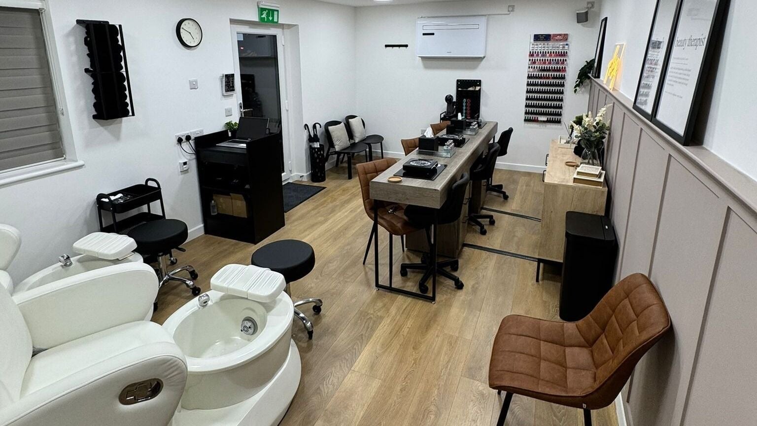 Chic interior of BN Beauty - Peacehaven in Peacehaven, England, GB showcasing elegant manicure and pedicure stations.