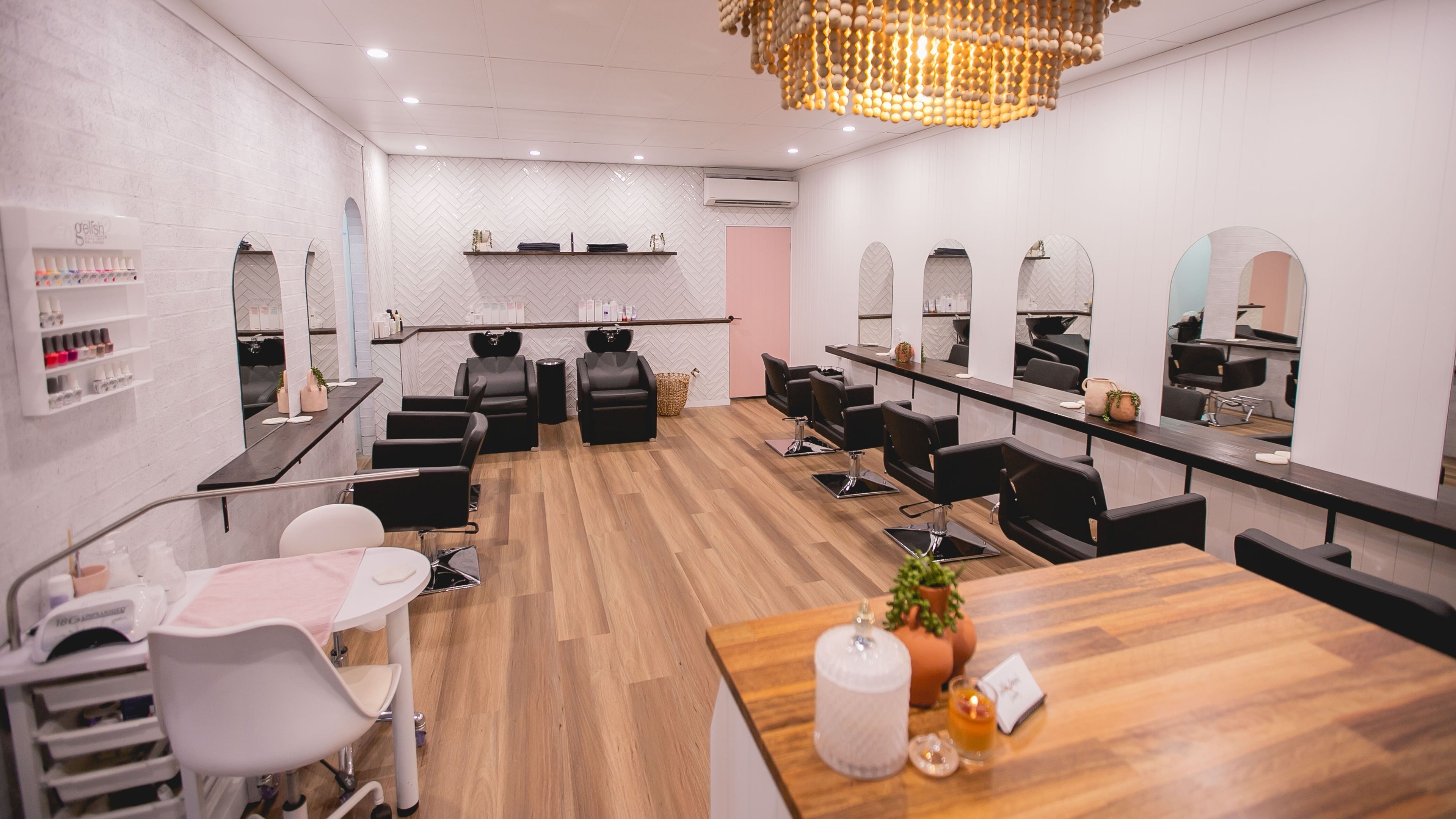Modern interior of Wild About Hair and Beauty, Runaway Bay, Queensland, AU, featuring stylish salon stations.