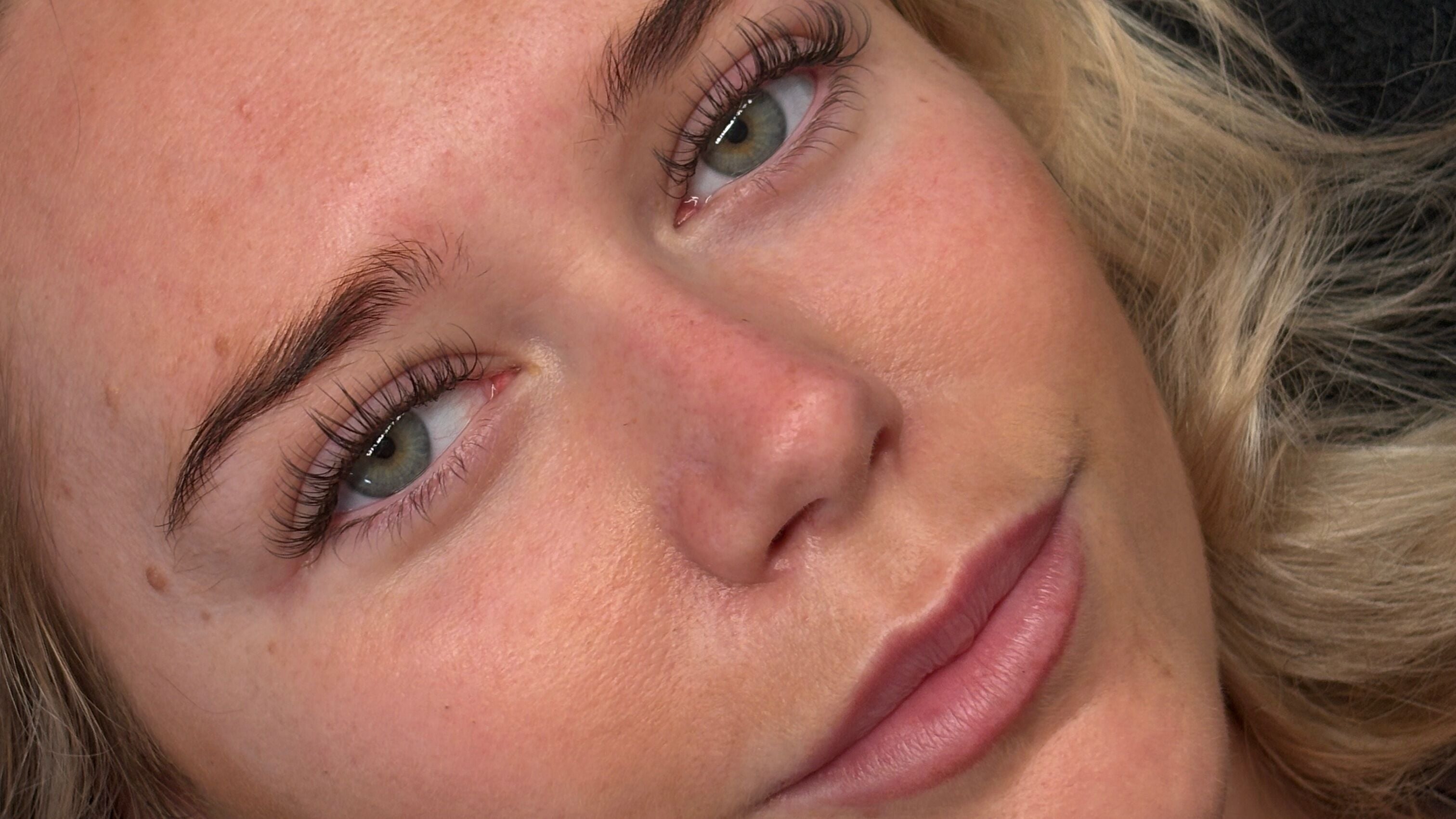 Close-up of a woman's face with full lashes at De Witt’s Beauty Bar, Melbourne, Victoria, AU.