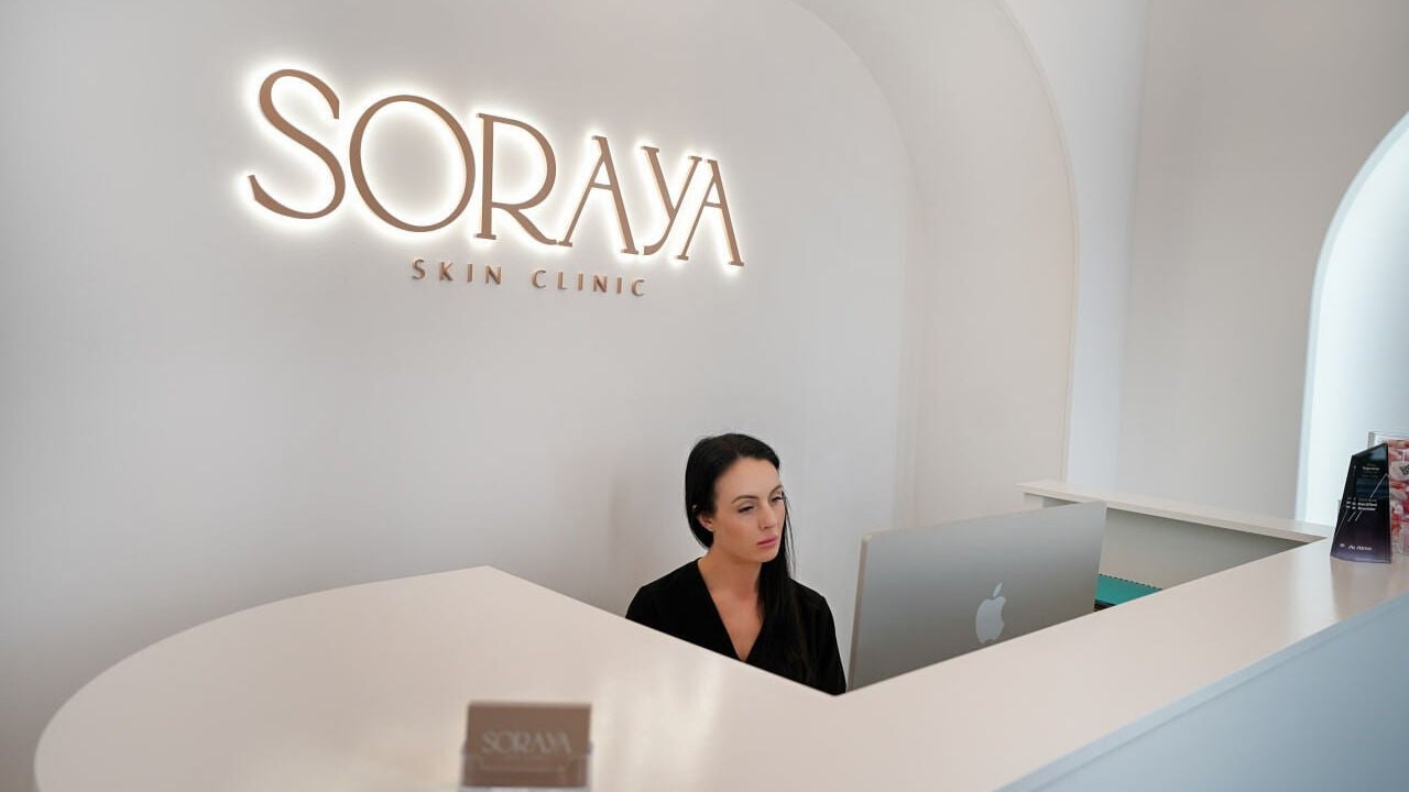 Reception desk at Soraya Skin Clinic Prahran, featuring a welcoming staff member, Prahran, Victoria, AU.