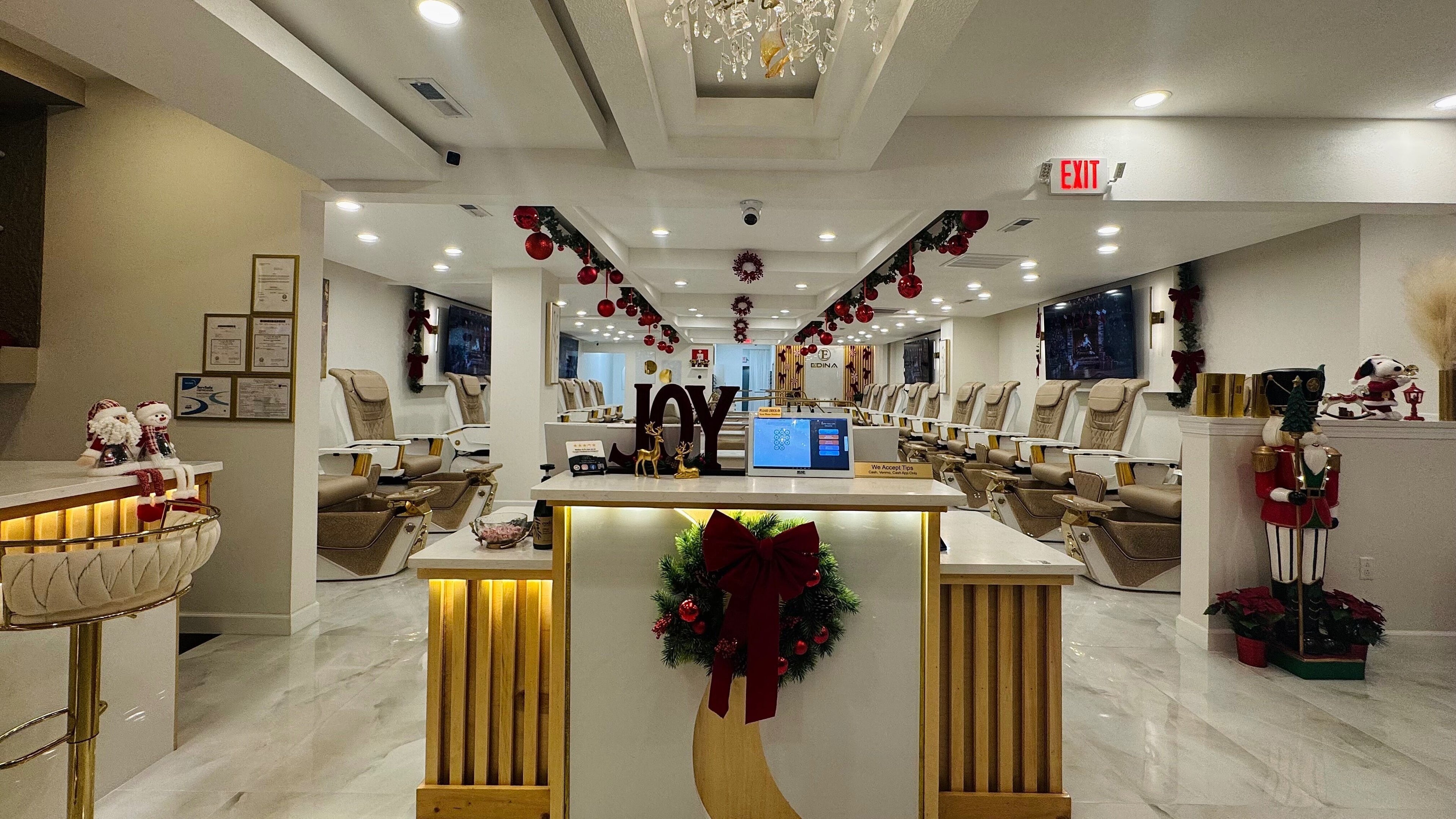 Edina Nails Spa interior with festive decor and comfortable seating in Delaware, Ohio, US.