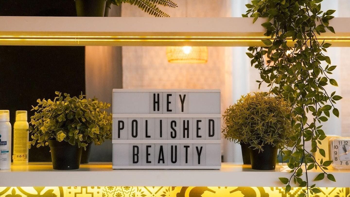 Polished Spa in Sharjah, AE: inviting display with plants and 'Hey Polished Beauty' sign.