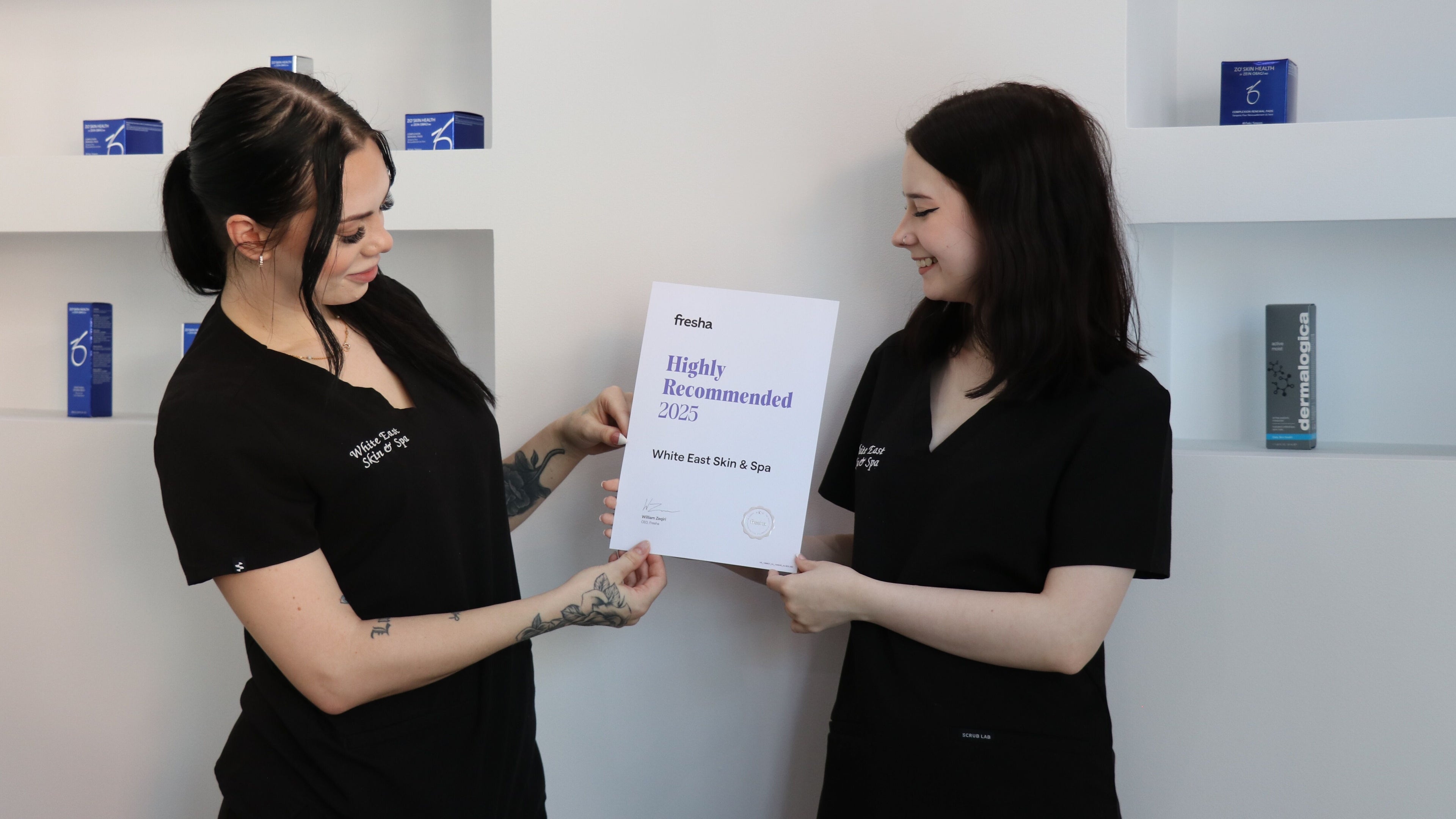 Staff at White East Skin & Spa, Melbourne, Victoria, AU, proudly hold a 2025 award certificate.