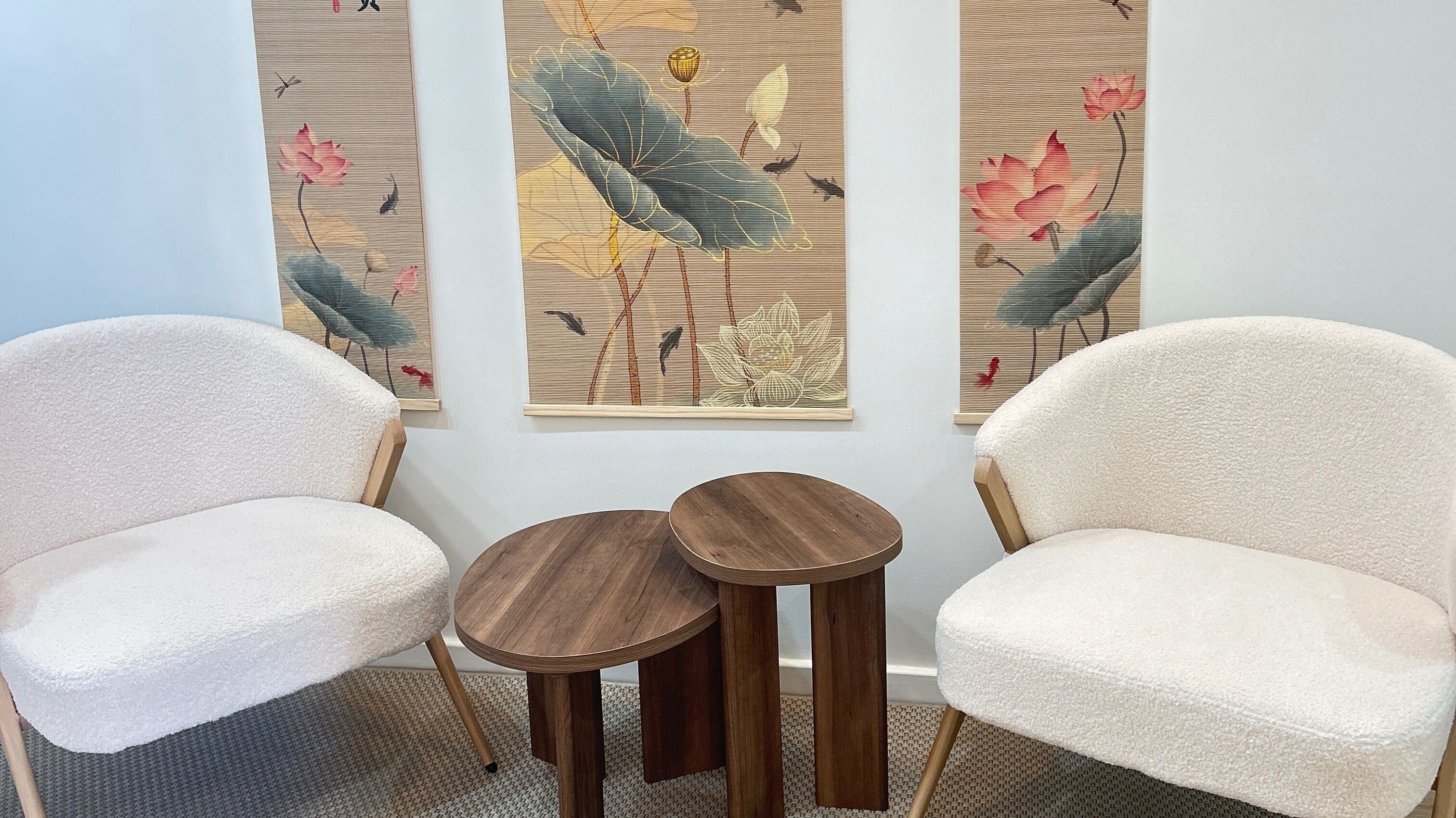 Cozy white chairs and wooden tables at Lotus Crown Spa, Joondalup, Western Australia, AU with lotus artwork.