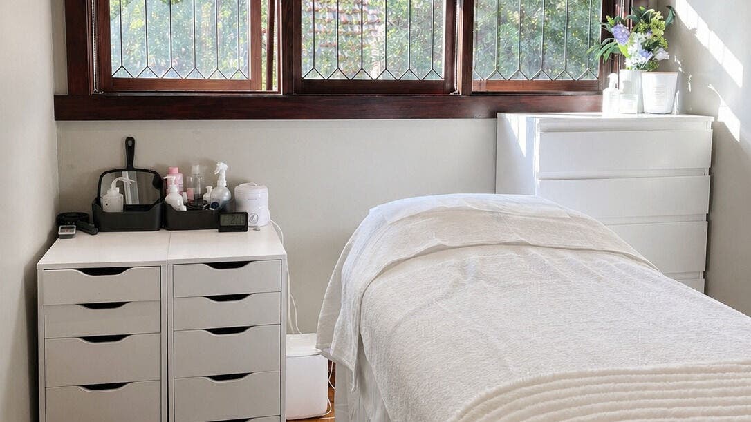 Relaxing treatment room at Beauty by AC, Melbourne, Victoria, AU with bed and natural light.