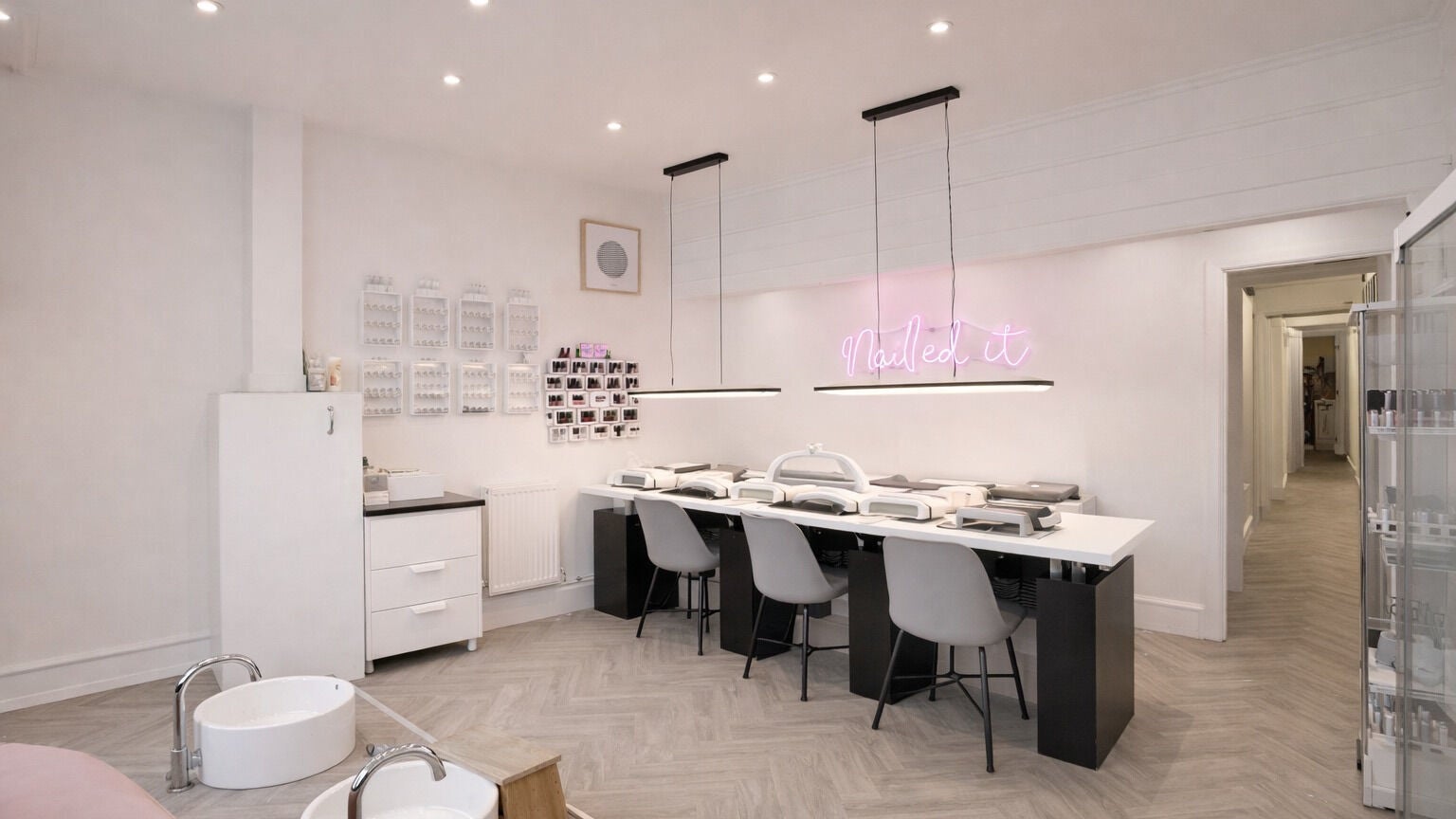 Chic interior of Polished 10 The Street Ashtead, located in Ashtead, England, GB, showcasing stylish nail stations.