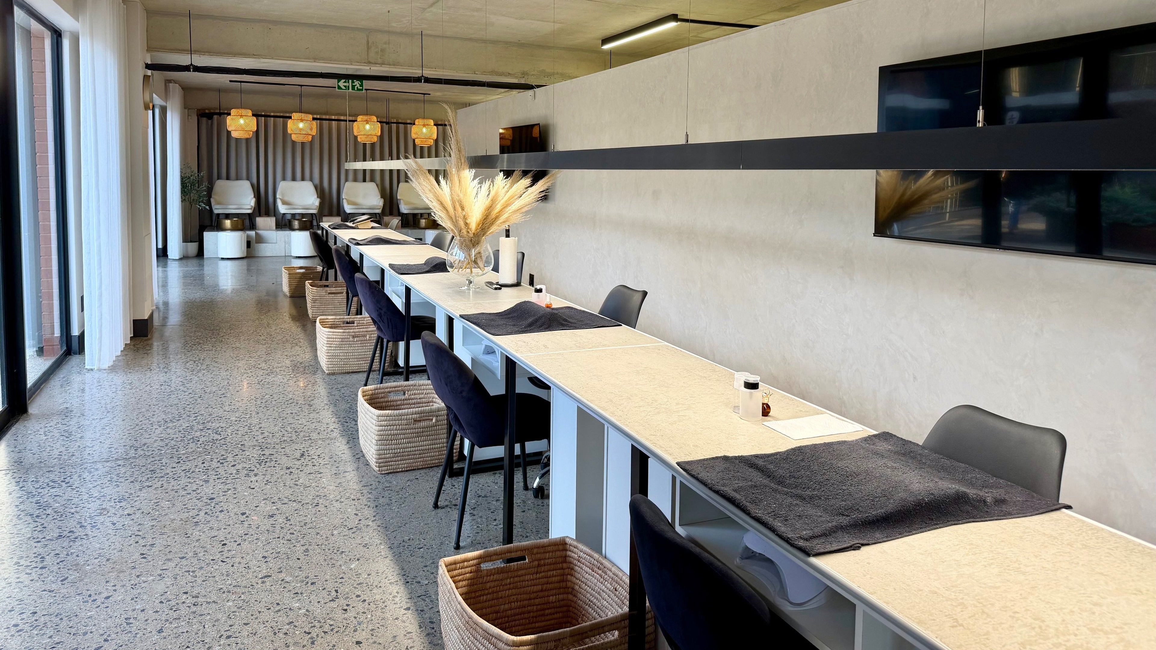 Modern salon chairs and tables at SALT Beauty Bar in Centurion, Gauteng, ZA with elegant decor.
