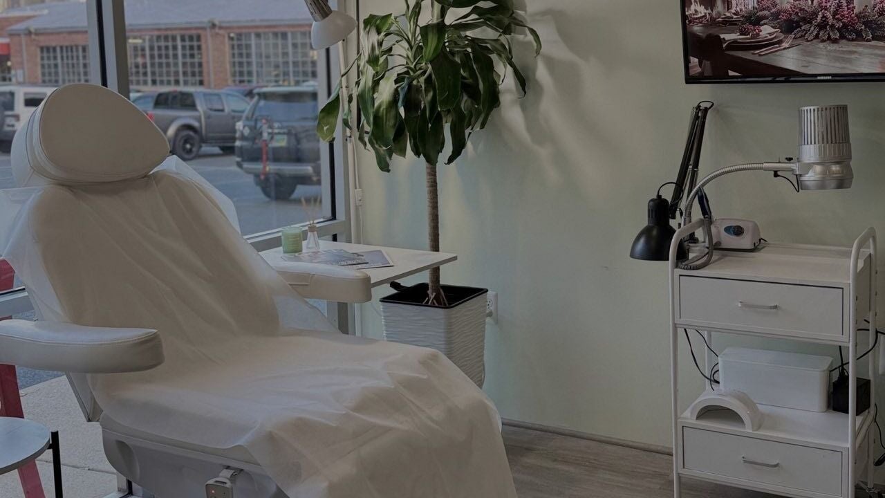 Relaxing nail treatment setup at Nail Expert in Arlington, Virginia, US with plush chair and equipment.