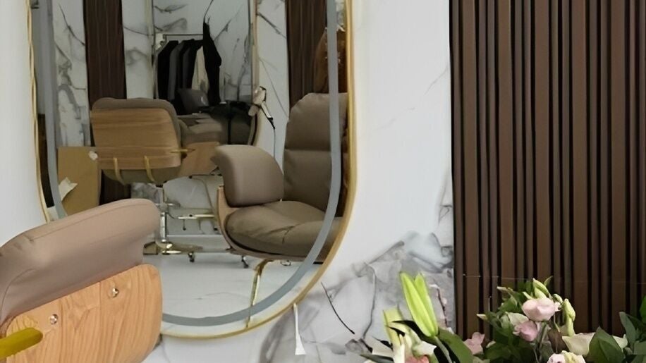 Luxurious salon interior at Bellaso, New York, NY, with modern decor and chic styling chairs.