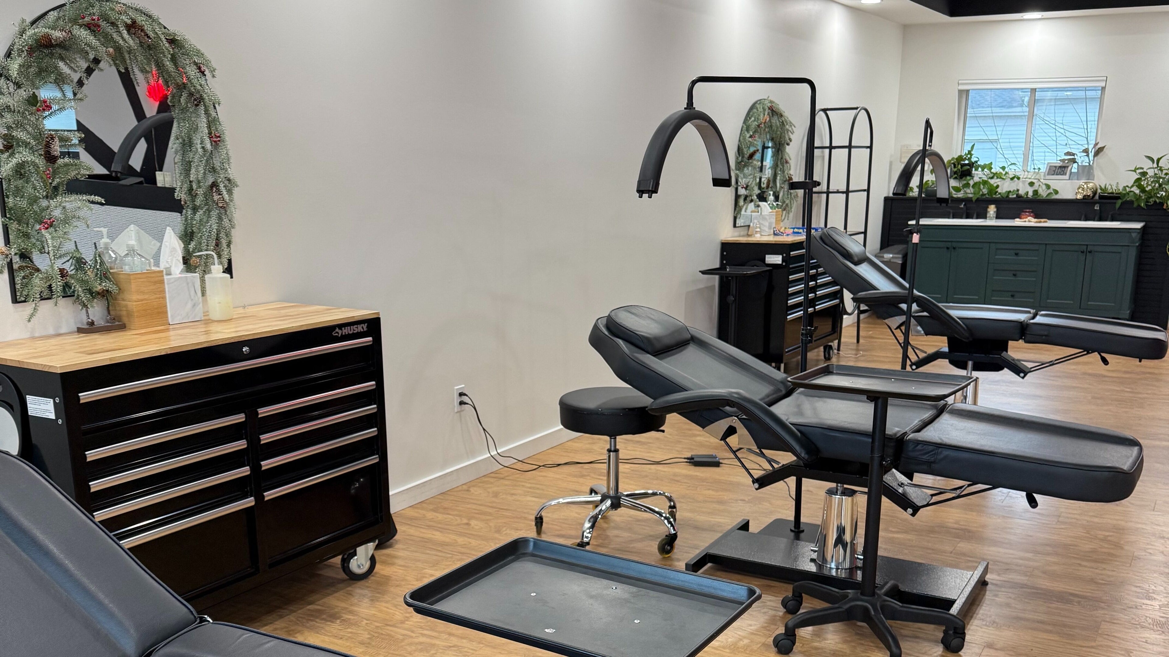 The Modern Female salon interior in Westfield, Indiana, US featuring stylish treatment chairs and decor.