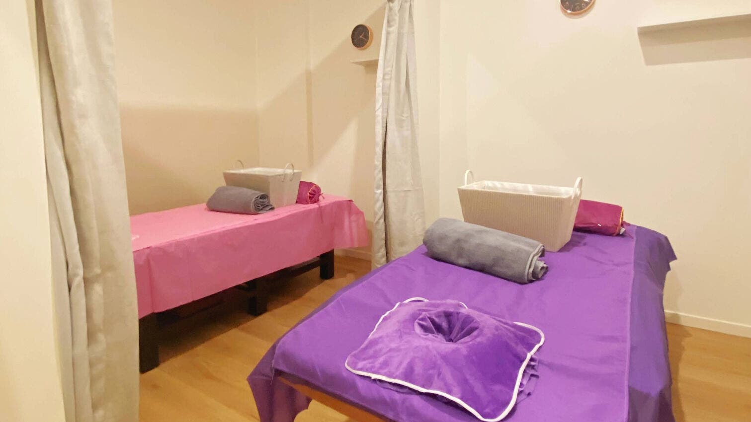 Calm massage room at Healing Hands Massage & Acupuncture in Brassall, Queensland, AU with two prepared beds.