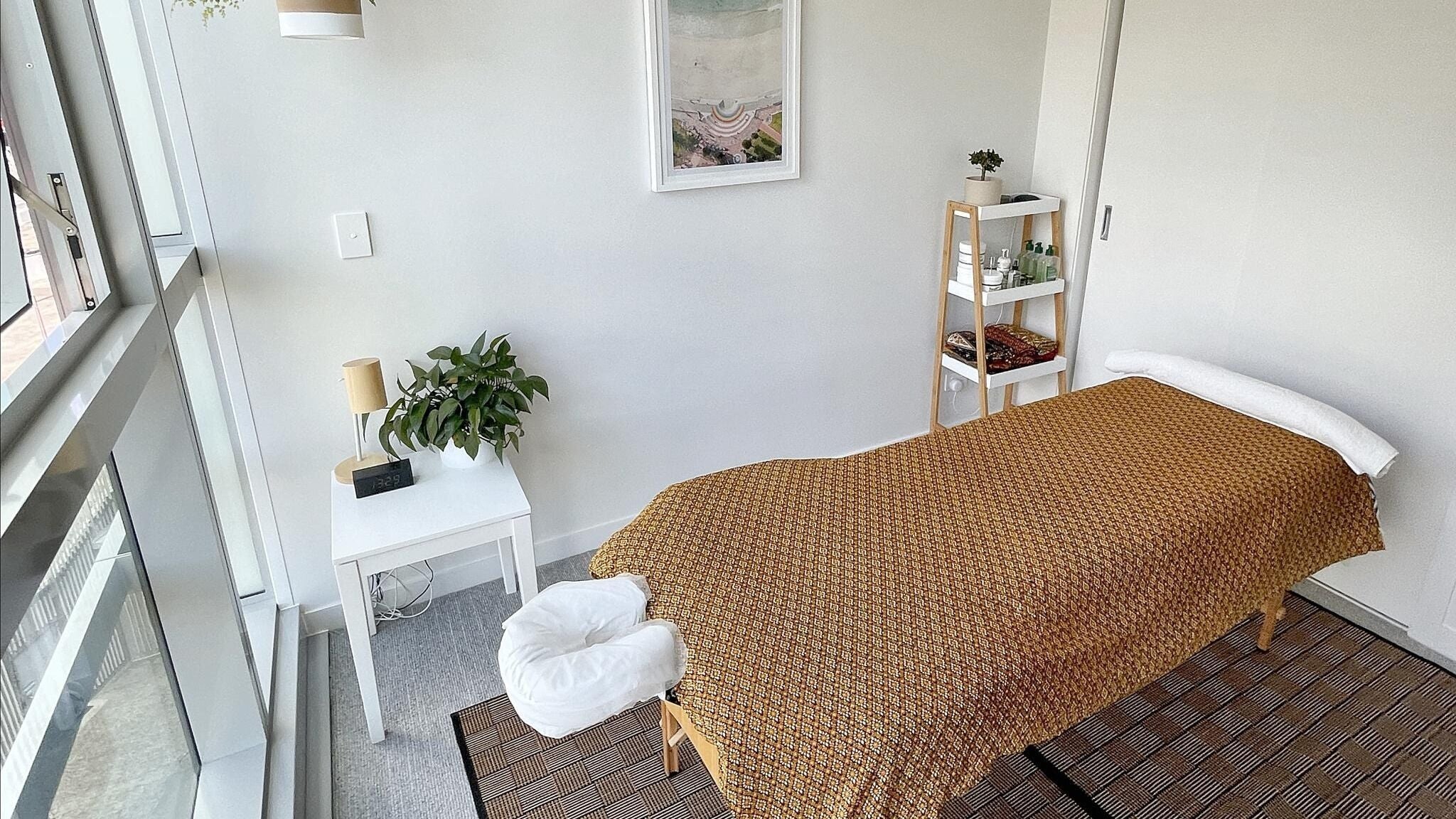 Relaxing massage room at Massage with Sanon, Auckland, Auckland, NZ, with a cozy table and tranquil decor.