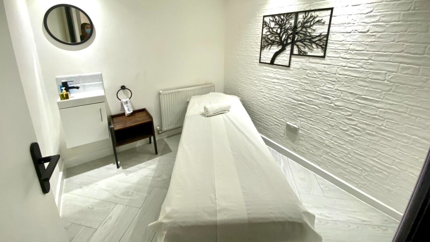 Private massage room at Thai Harmony Spa & Massage, London, England, GB, featuring a serene, minimalist design.