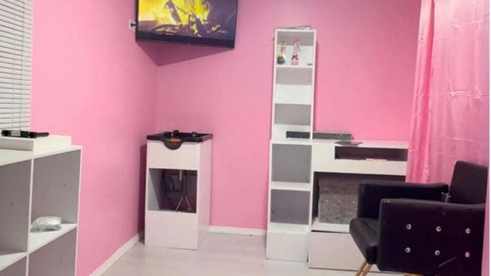 Stylish pink interior of Braid & Beauyy Loft, Bridgetown, Saint Michael, BB showcasing chic decor and seating.