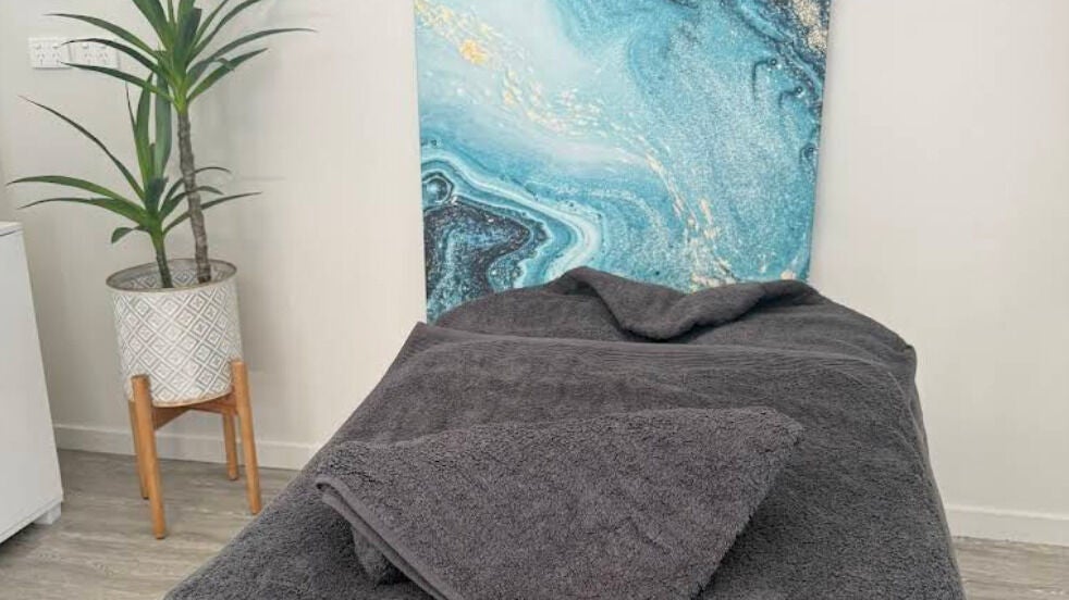 Tranquil massage room at Massage Relax Restore Townsville in Garbutt, Queensland, AU with a calming decor.