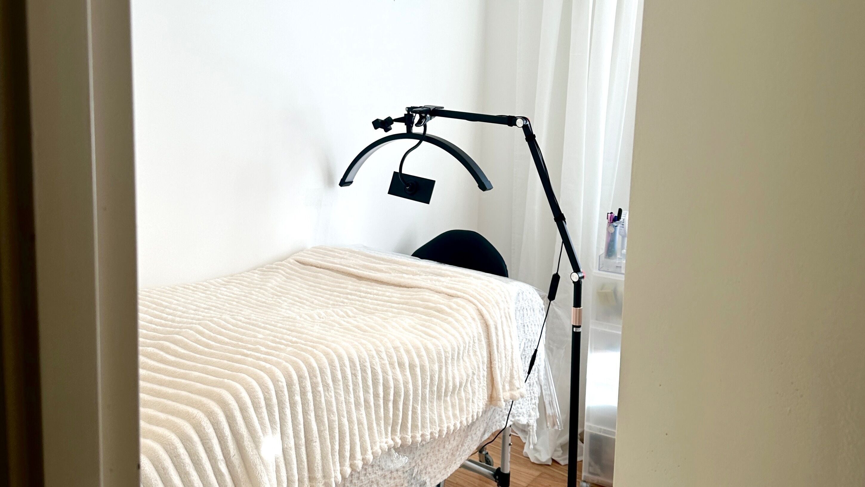 Cozy treatment room at Msyelash in Melbourne, Victoria, AU with a comfortable bed and professional lighting.