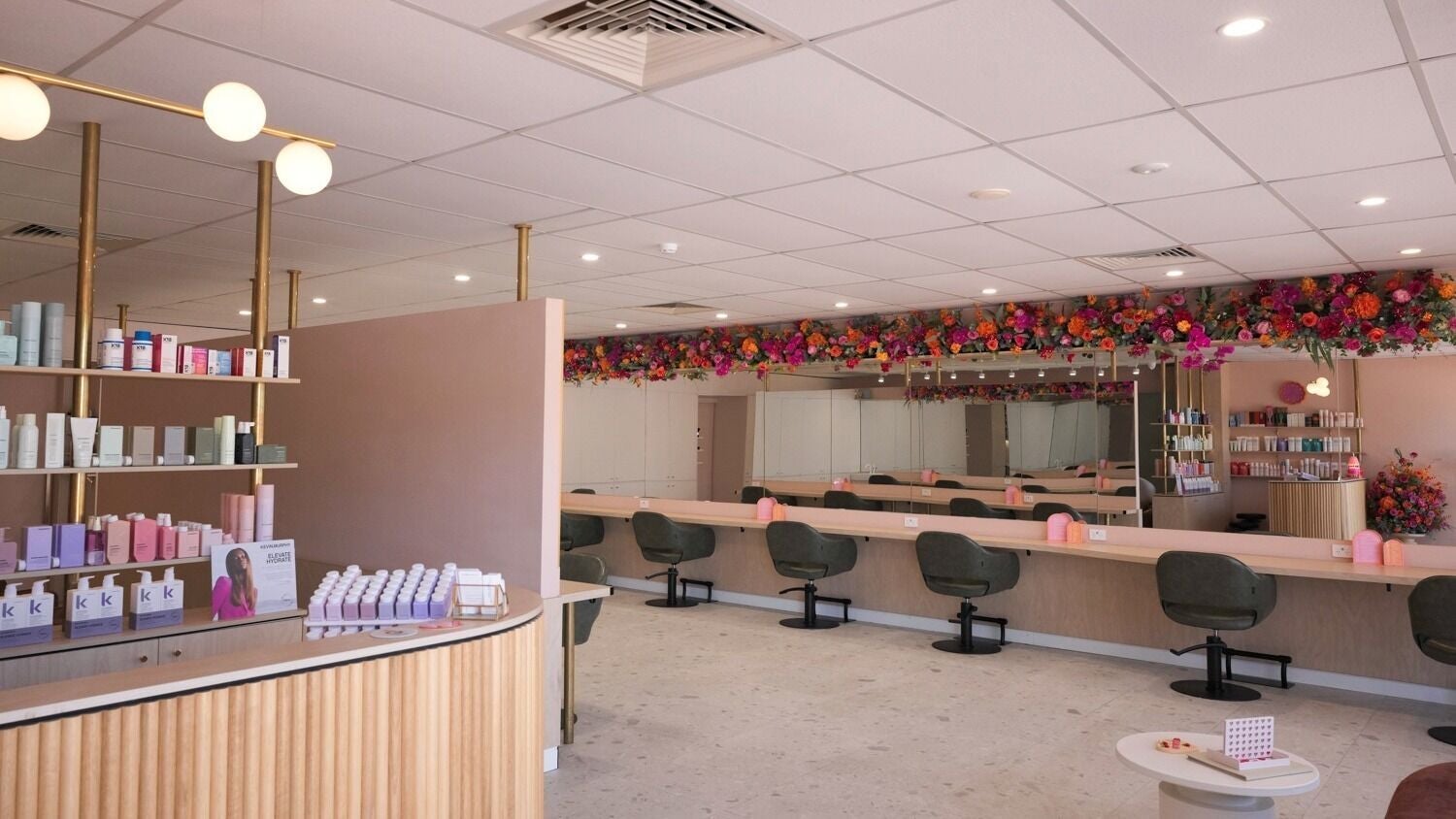 Elegant salon interior at Wild Rose Hair Inglewood, Western Australia, AU with stylish decor and vibrant floral accents.