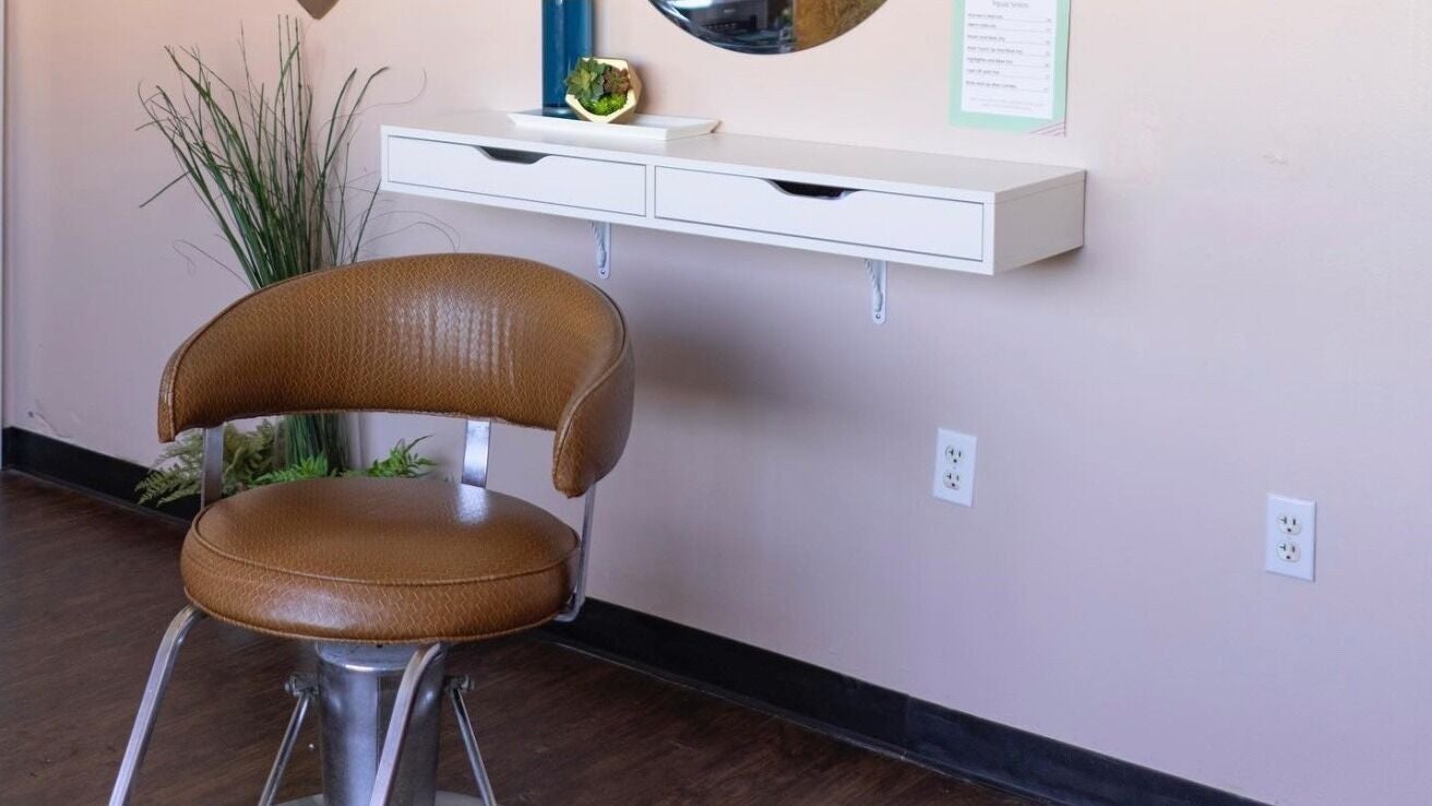 Elegant styling chair at The Grey Rose Salon, Dallas, Pennsylvania, US, with chic decor and modern design.