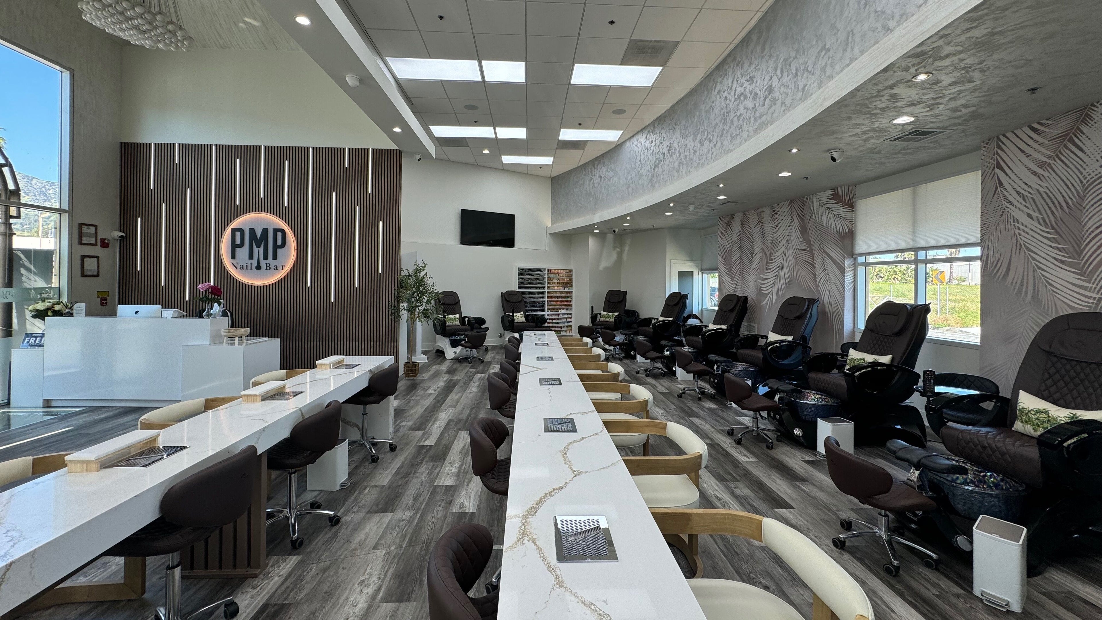 Elegant interior of Polish Me Pretty Nail Bar in Burbank, California, US, showcasing manicure and pedicure stations.