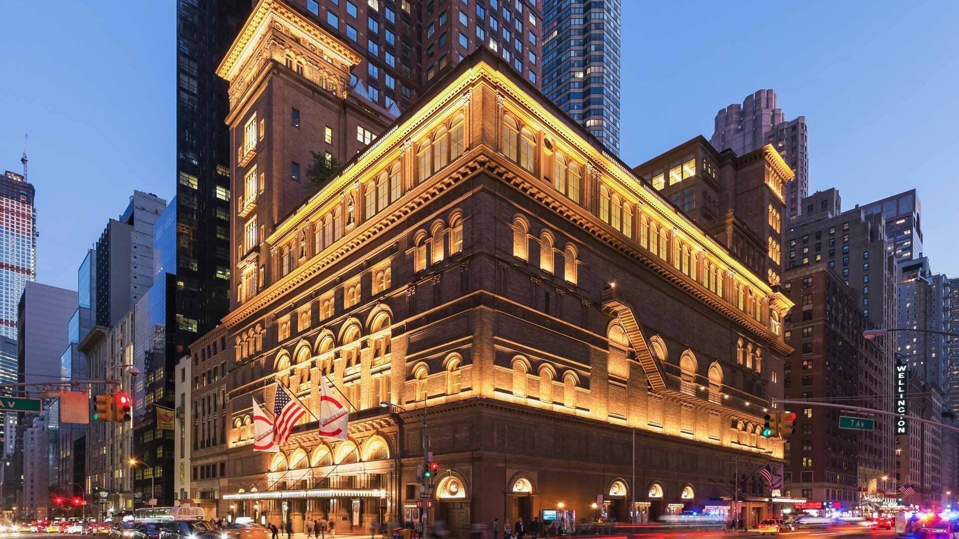 Elegant New York building near Zegna Nails MIDTOWN, New York, New York, US at dusk.