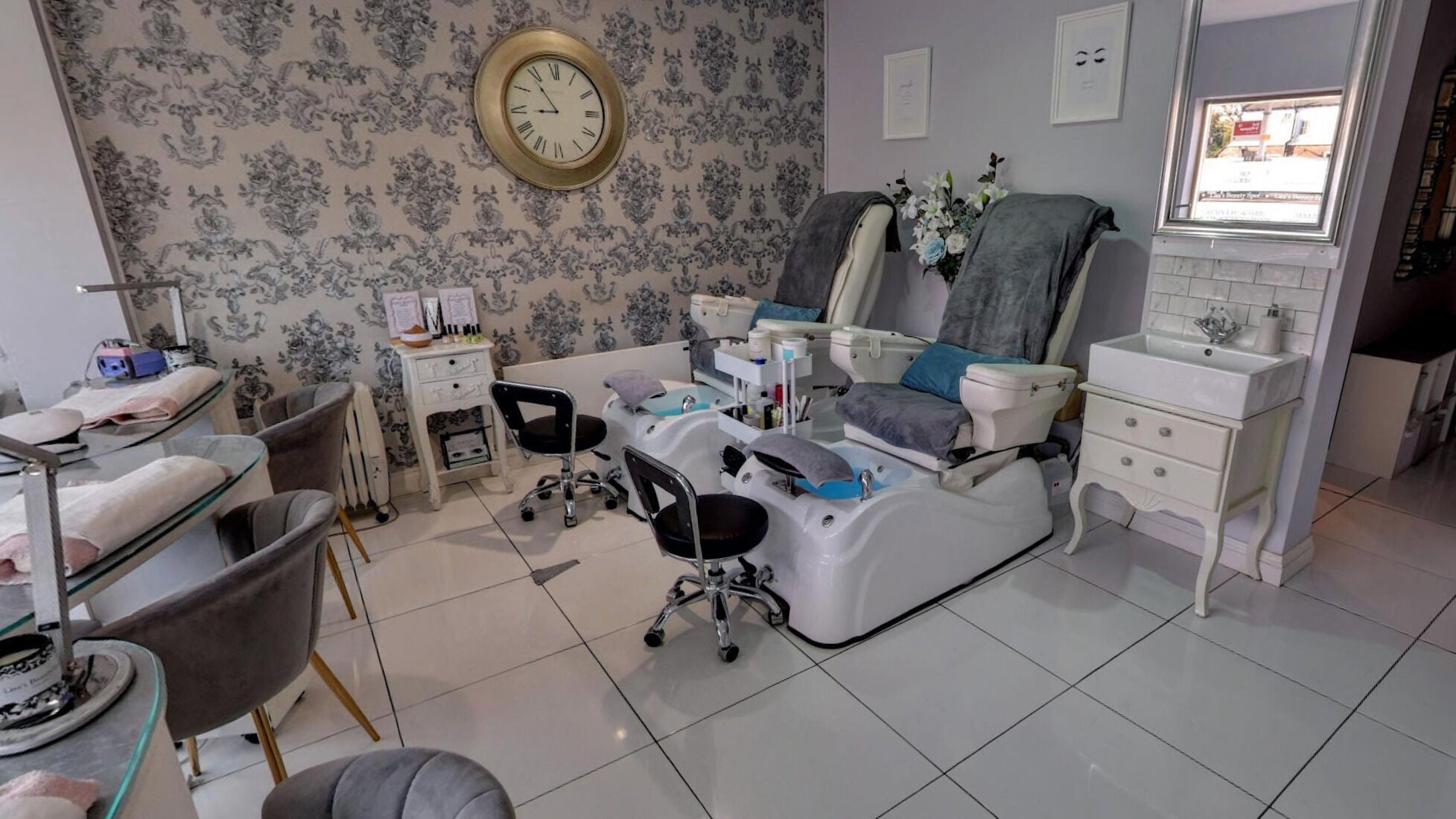 Cozy pedicure and manicure area at Lisa's Beauty Spot, Amersham, England, GB, featuring plush seating.
