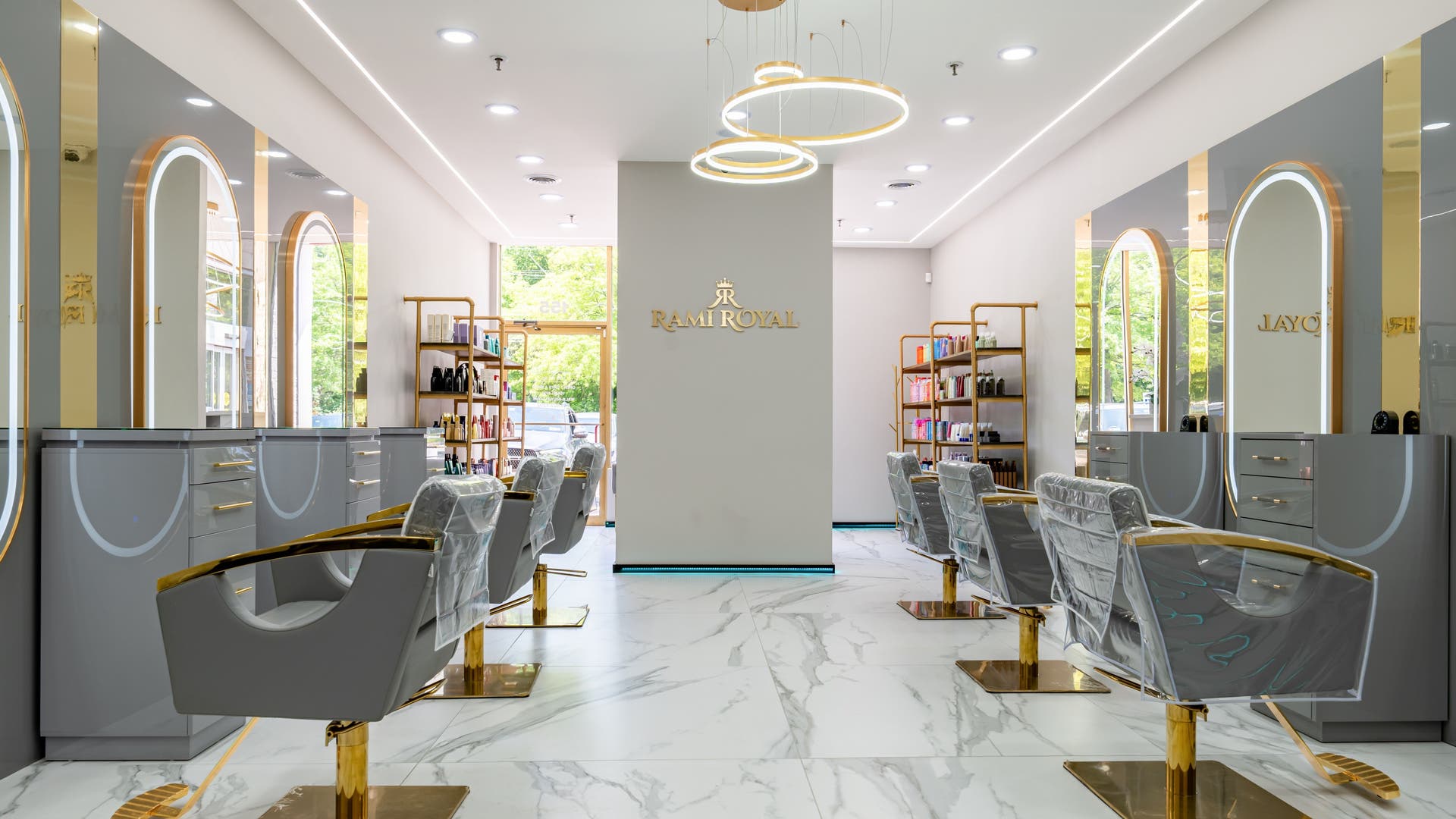Elegant interior of Rami Royal Hair Salon in Oyster Bay, New York, US with modern decor and styling chairs.