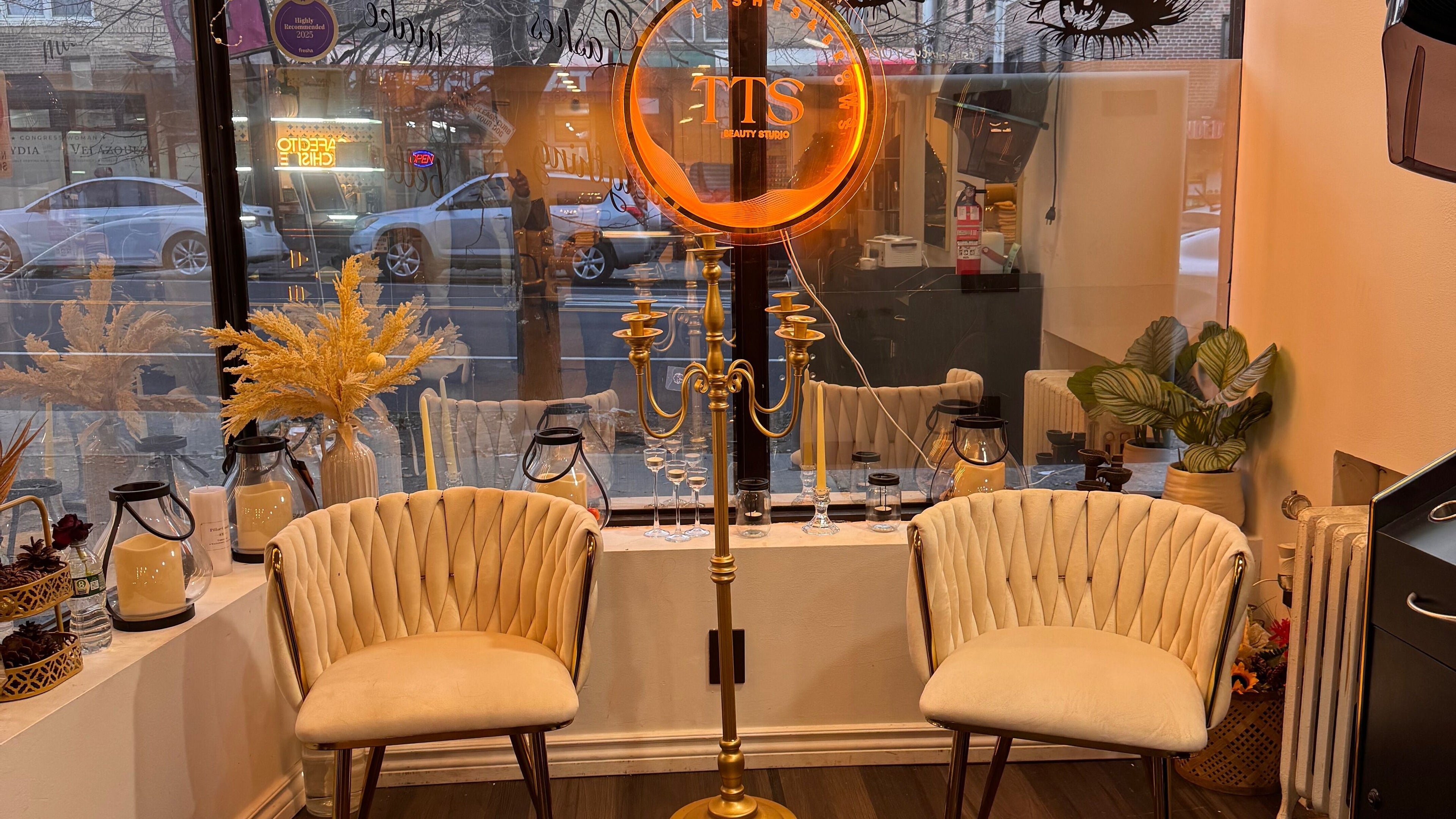 Elegant seating area at Tts Beauty Studios, Sunnyside, New York, US with tasteful decor and soft lighting.