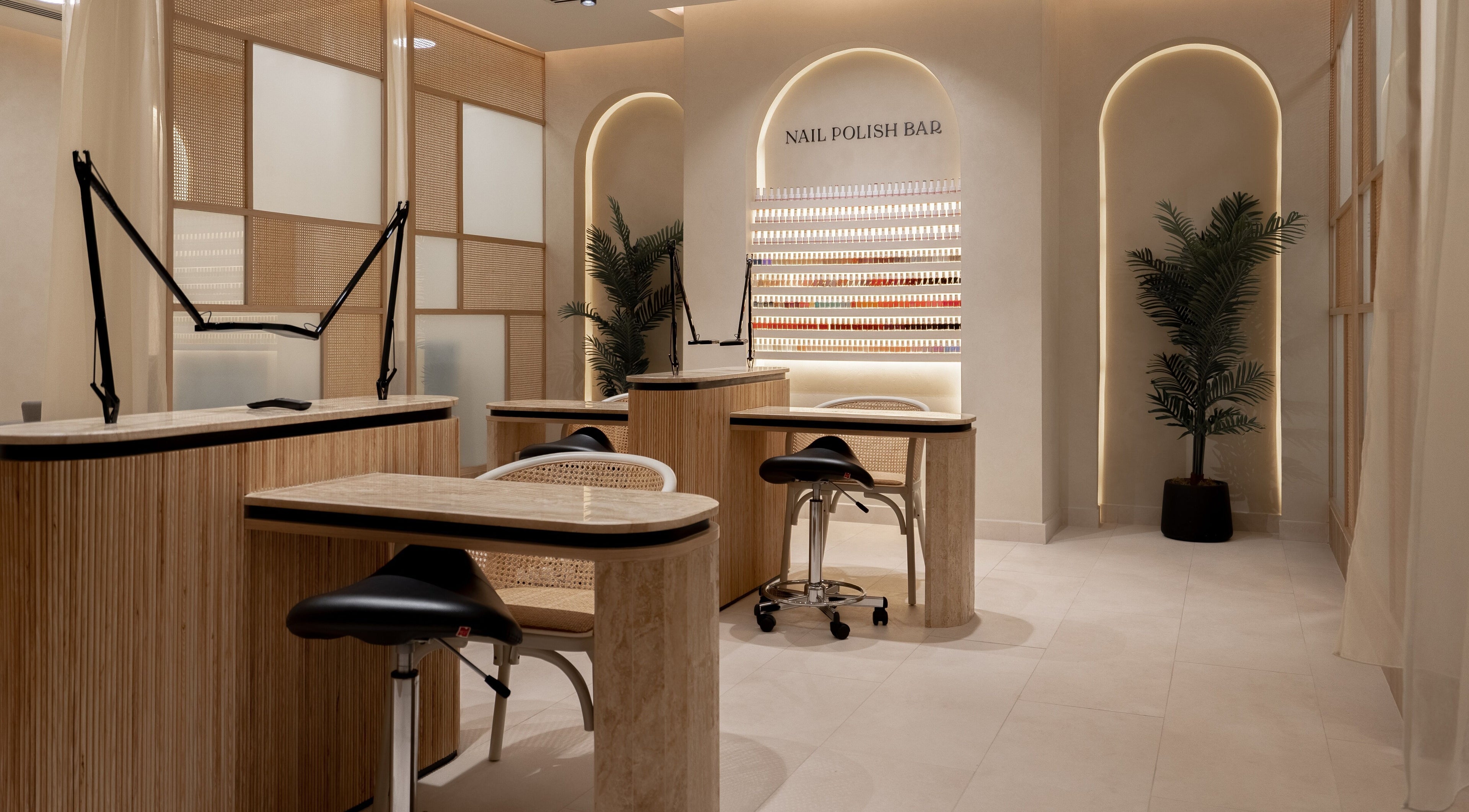 Chic nail polish bar at Remedy Room, Abu Dhabi, Abu Dhabi, AE with modern seating and ambient lighting.