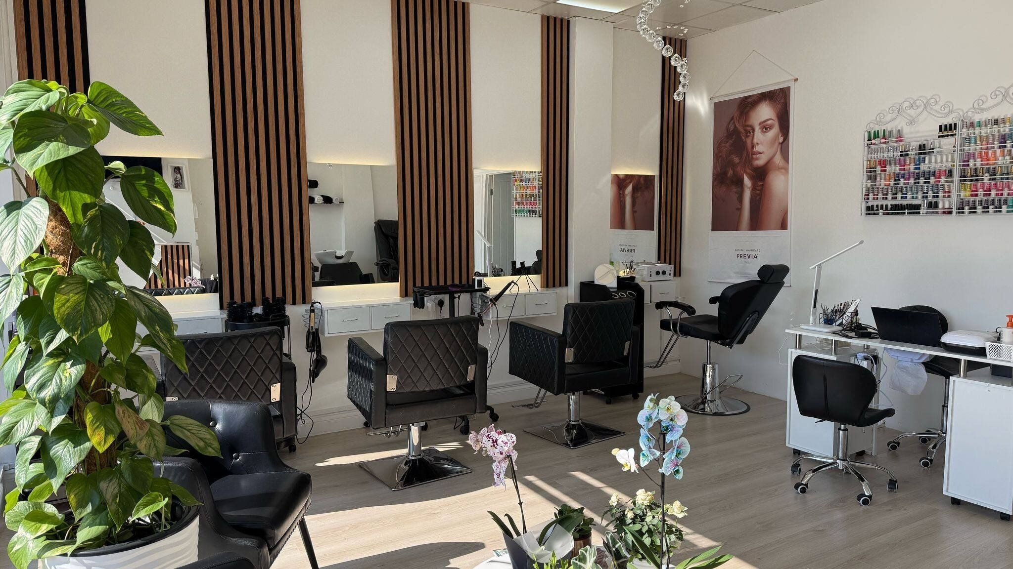 Sophisticated salon interior at ZS Hair & Beauty, Welling, England, GB, featuring stylish chairs and mirrors.