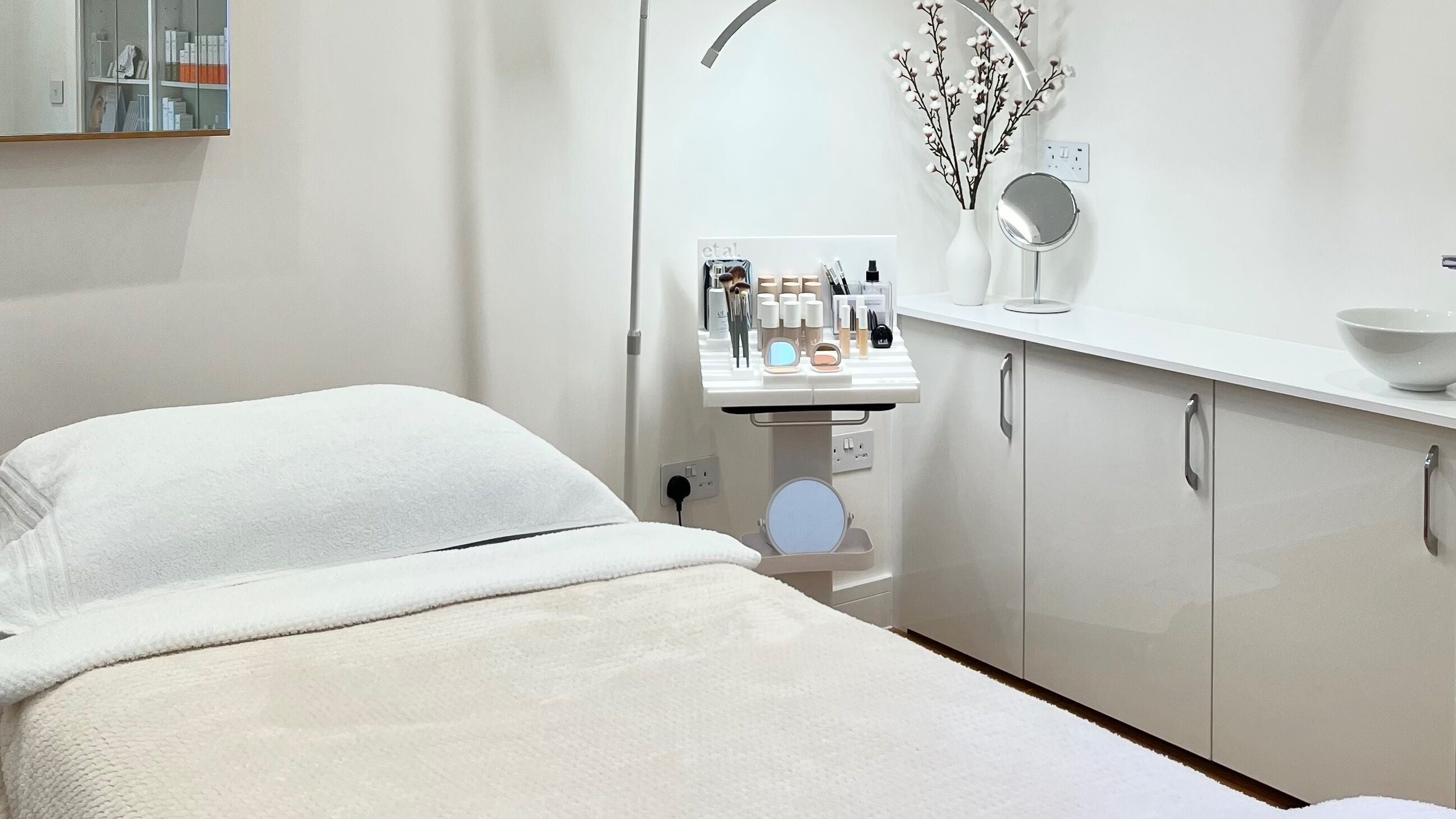 Tranquil treatment room at Bliss Beauty Studio, London, England, GB with cozy bed and modern decor.