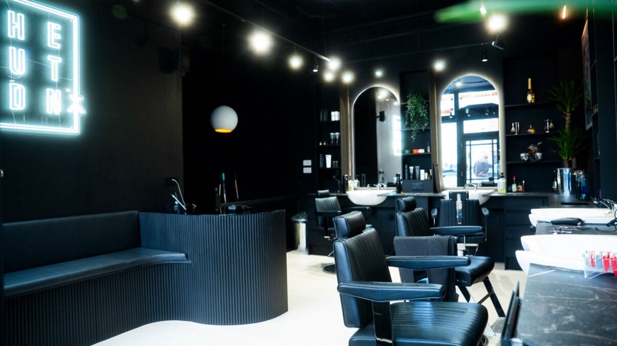 Stylish interior of The Cut LDN - Fulham, featuring sleek black chairs and modern decor in London, England, GB.