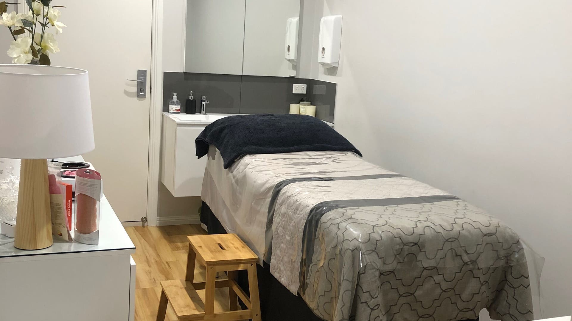 Elegant treatment room at Amberlea’s Elegant Images, Maffra, Victoria, AU, with a cozy massage bed and decor.