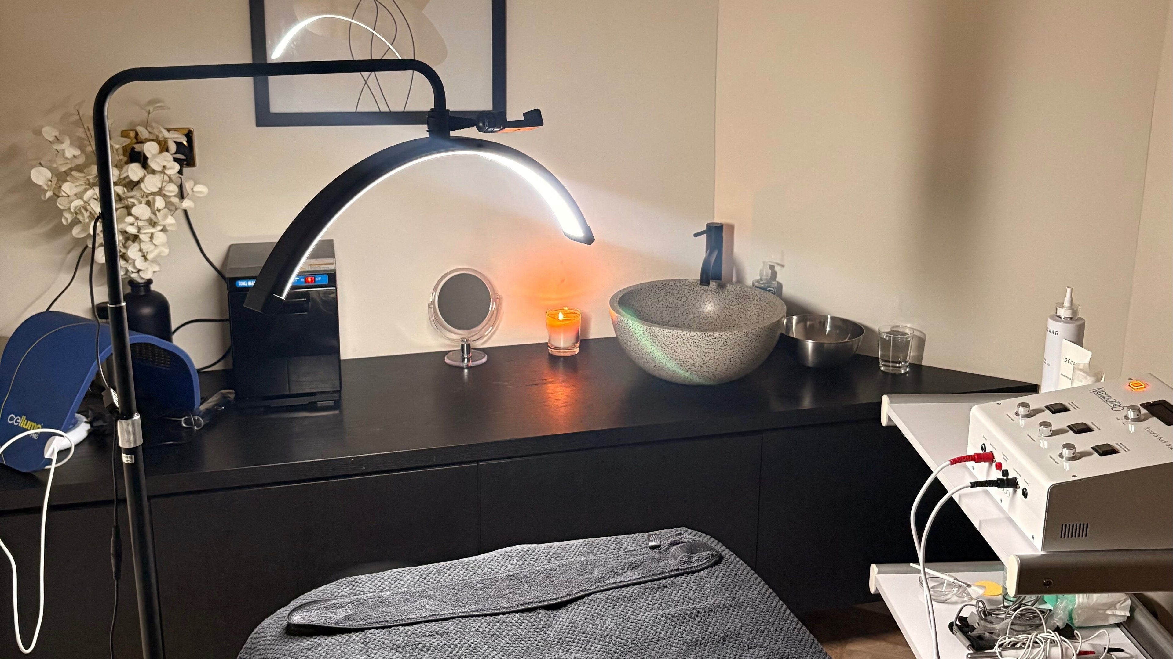 Serene treatment room at Betty Klein, London, England, GB featuring ambient lighting and modern equipment.