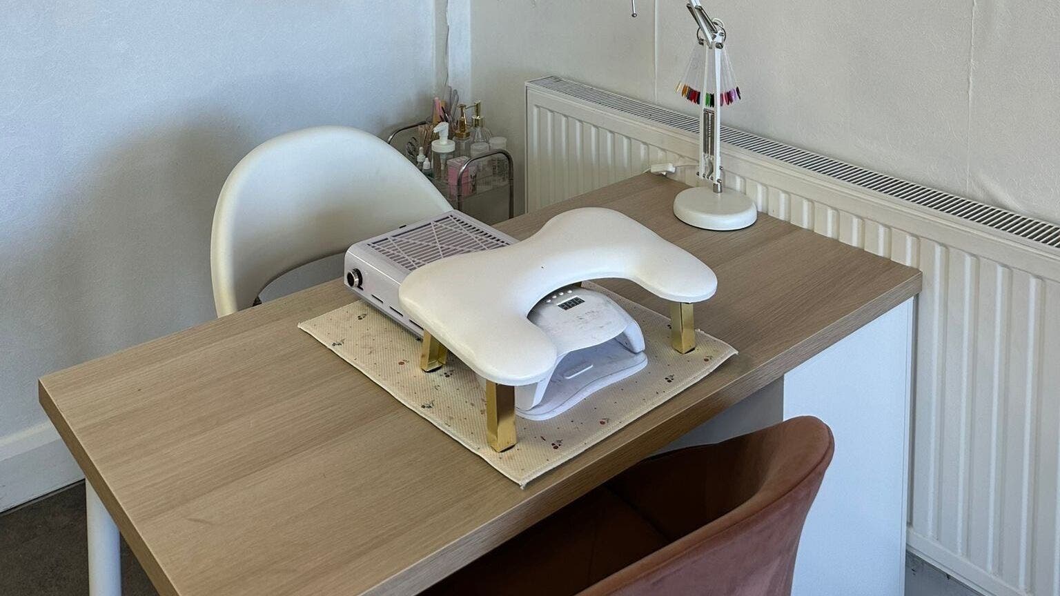 Nail station at London Laser&Beauty studio in Hornchurch, England, GB, featuring a modern desk and manicure equipment.