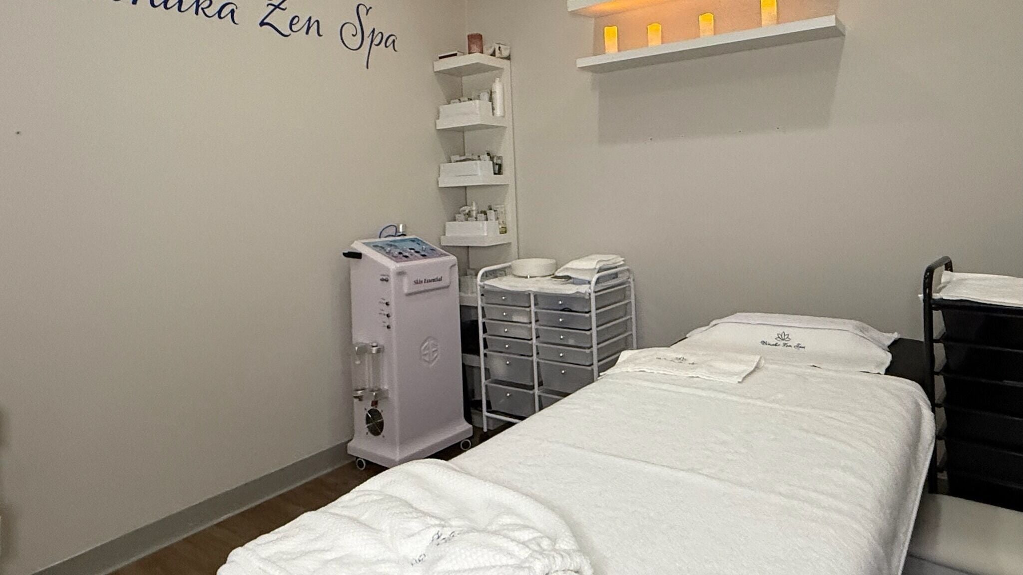 Serene massage room at Binaka Zen Spa, Carol Stream, Illinois, US with cozy bed and calming lights.